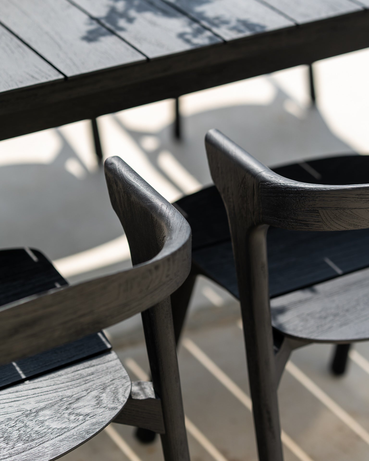 Bok Outdoor Dining Table, Teak Black - Goode Studio