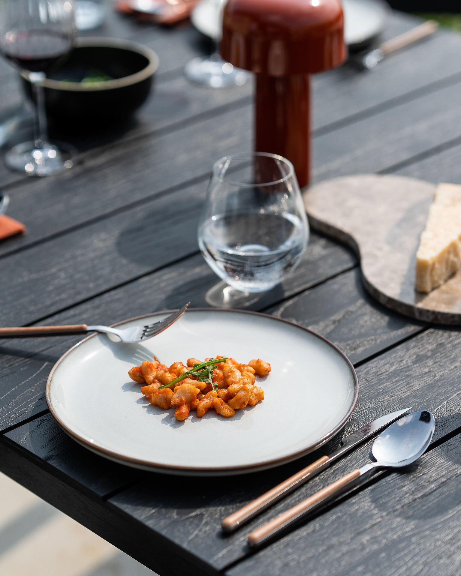 Bok Outdoor Dining Table, Teak Black - Goode Studio