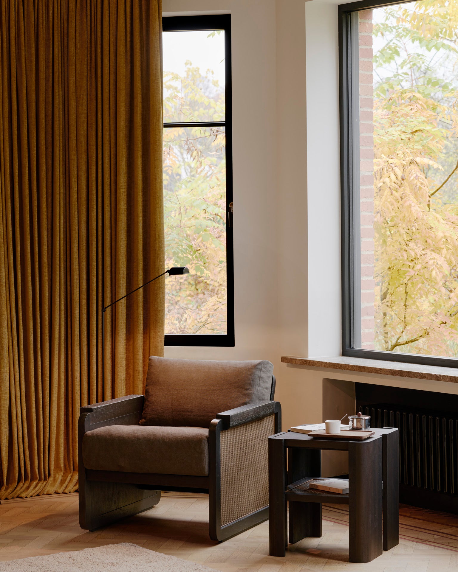 Panel-lounge-chair-varnished-teak-dark-brown-rattan-roasted-Grey-linen-Panel-side-table-varnished-teak-Roasted-square-lights-Goode-Studio