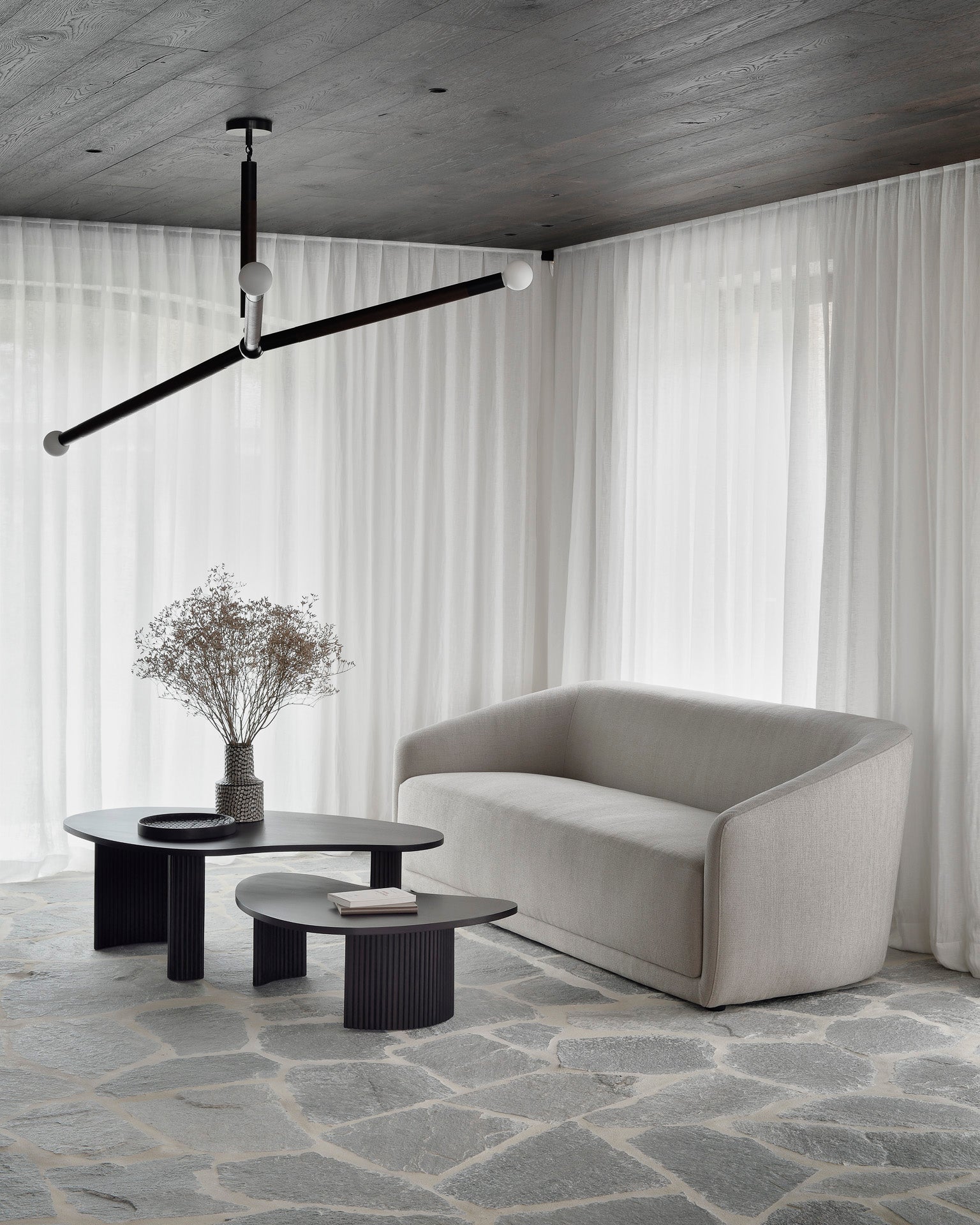 Trapeze-sofa-beige-Mahogany-Boomerang-coffee-table-Goode-Studio