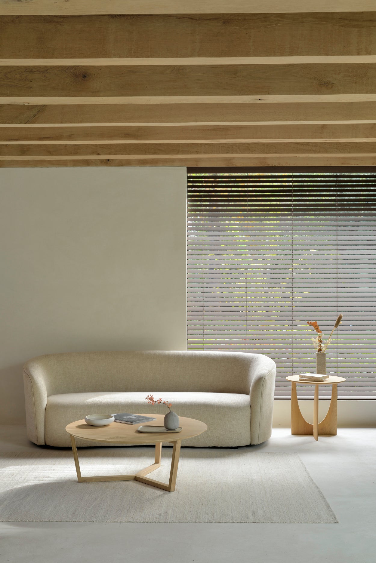 Sand-Nomad-kilim-rug-ellipse-sofa-3-seater-oatmeal-oak-geometric-side-table-oak-tripod-coffee-table-Goode-Studio