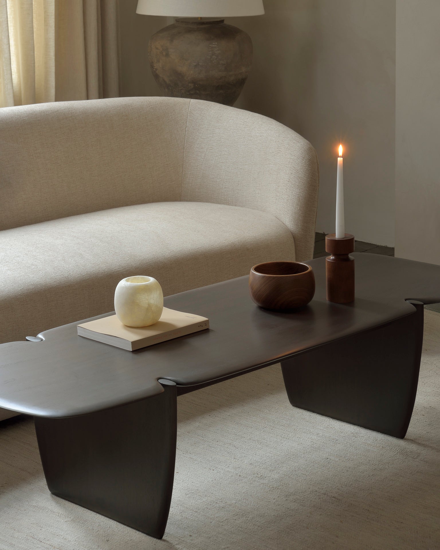 Sand-Nomad-kilim-rug-Ellipse-sofa-oatmeal-Mahogany-PI-dark-brown-coffee-table-Goode-Studio