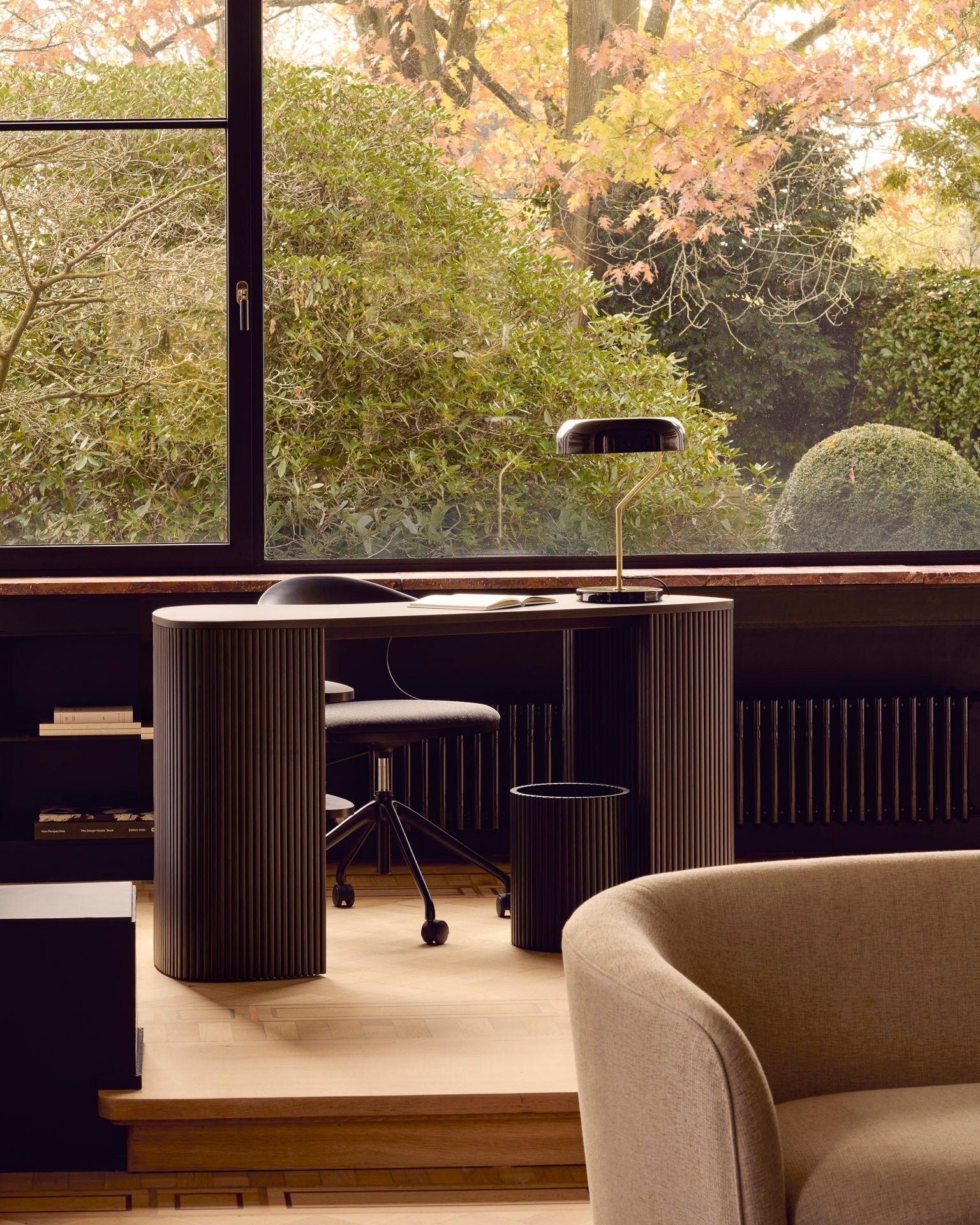 Roller-Max-desk-varnished-mahogany-dark-brown-pebble-shape-Bok-office-chair-varnished-mahogany-off-black-Dark-Grey-fabric-Roller-Max-Paper-basket-Ellipse-sofa-Goode-Studio