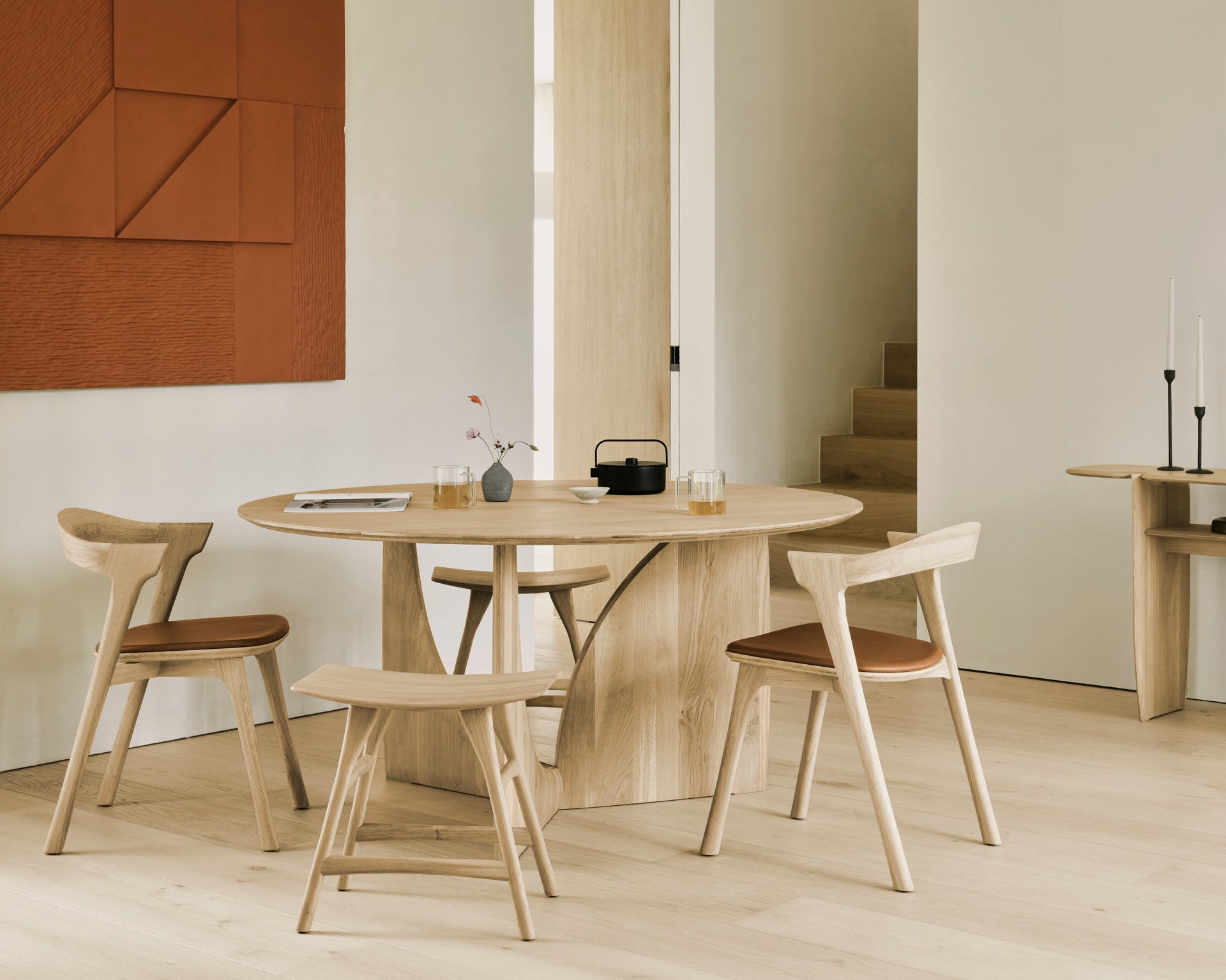 Geometric-dining-table-oak-round-Bok-chair-cognac-leather-Osso-stool-PI-console-Goode-Studio