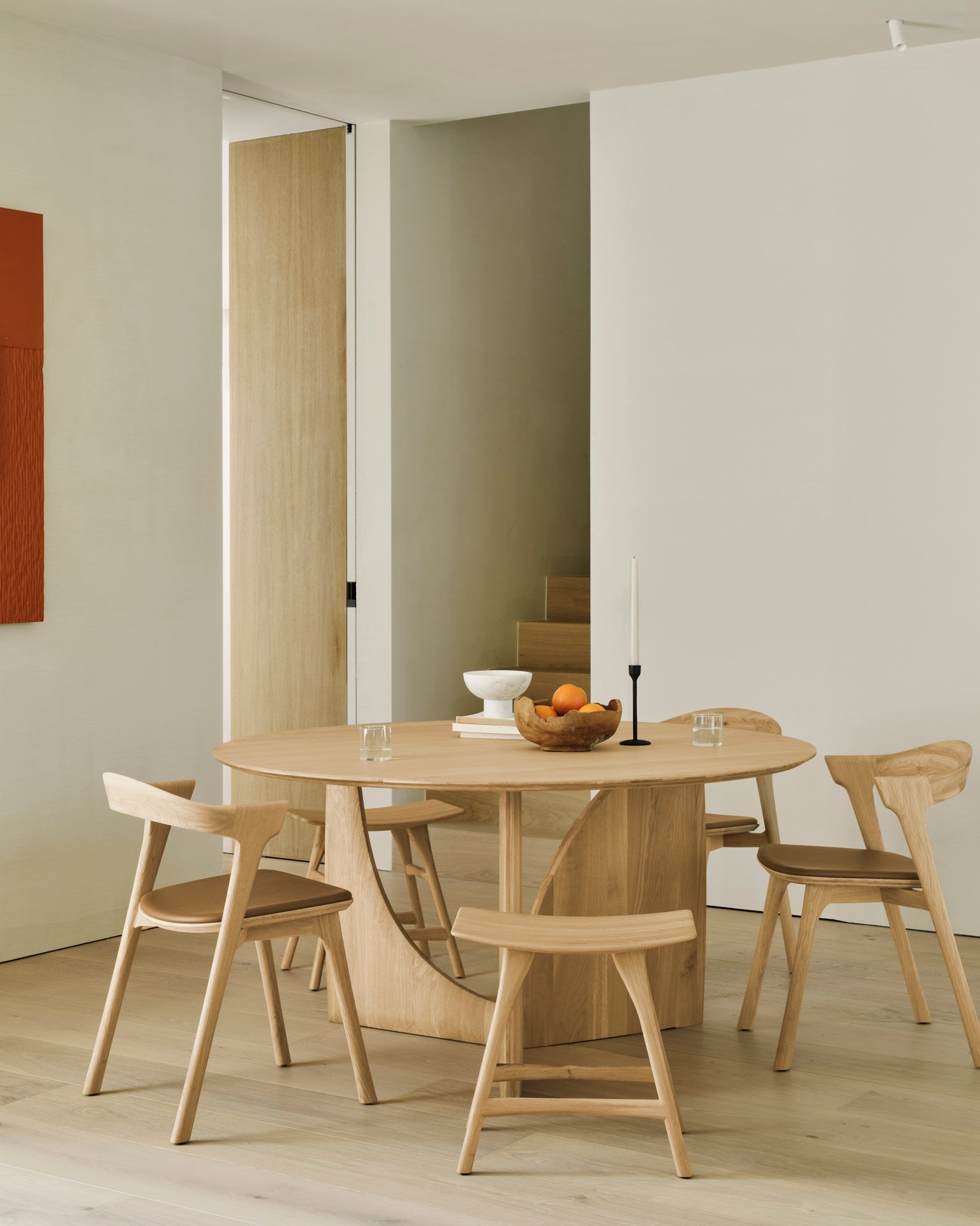 Geometric-dining-table-oak-round-Bok-chair-cognac-leather-Osso-stool-Goode-Studio