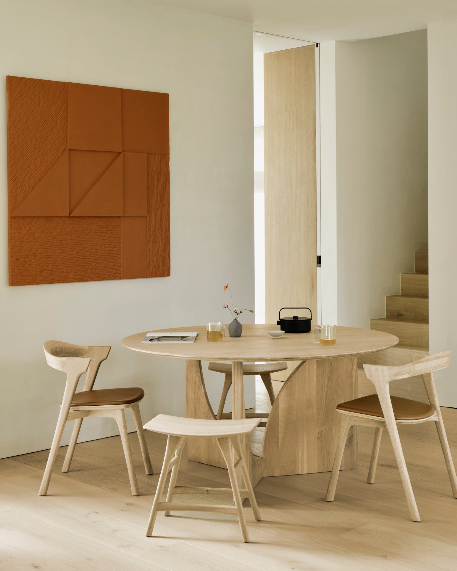 Geometric-dining-table-oak-round-Bok-chair-cognac-leather-Osso-stool-Goode-Studio