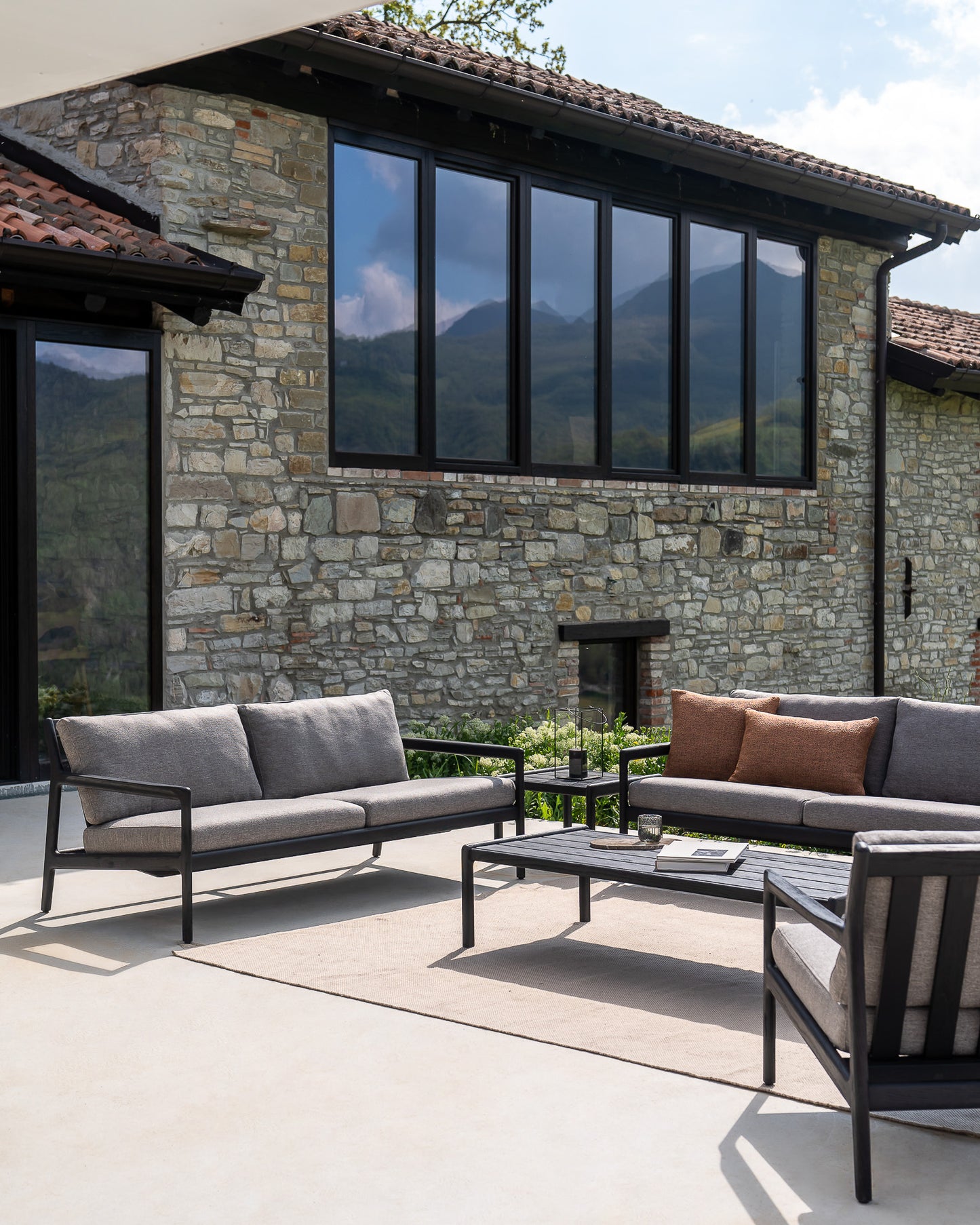 Jack-sofa-mocha-Nomad-cushion-Nomad-rug-Jack-side-table-coffee-table-Goode-Studio