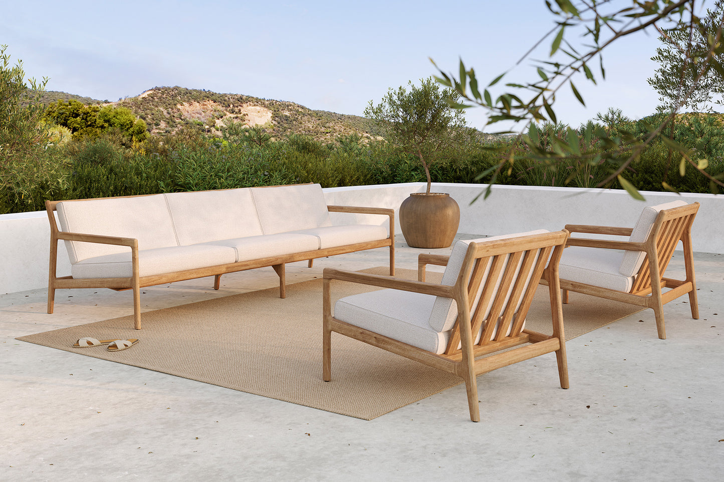 Teak-Jack-outdoor-sofa-off-white-Teak-Jack-outdoor-sofa-off-white-Nomad-indoor-outdoor-rug-Goode-Studio