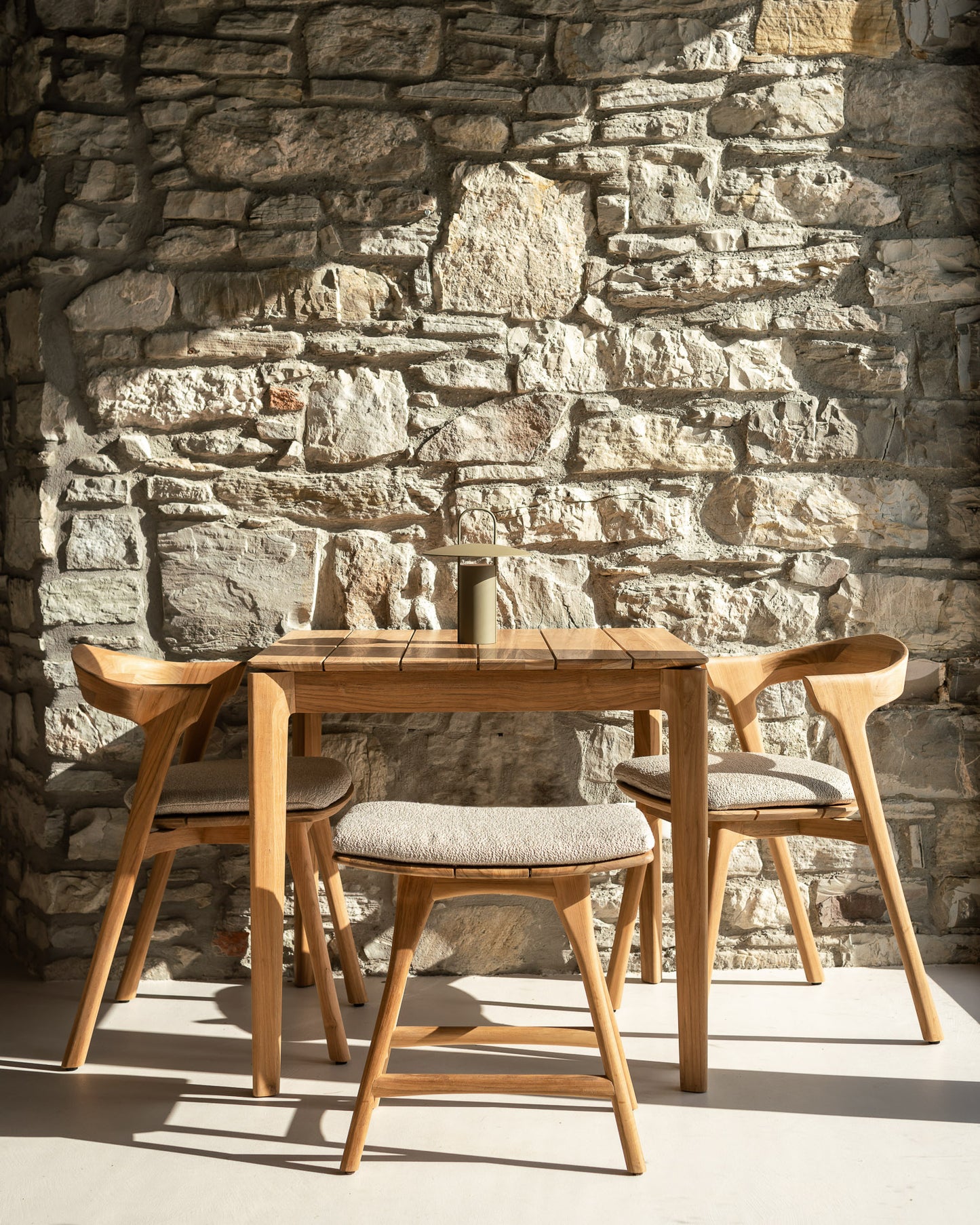 Bok-outdoor-dining-table-Bok-outdoor-dining-chair-Bok-cushion-off-white-Osso-outdoor-stool-Osso-stool-cushion-off-white-Goode-Studio