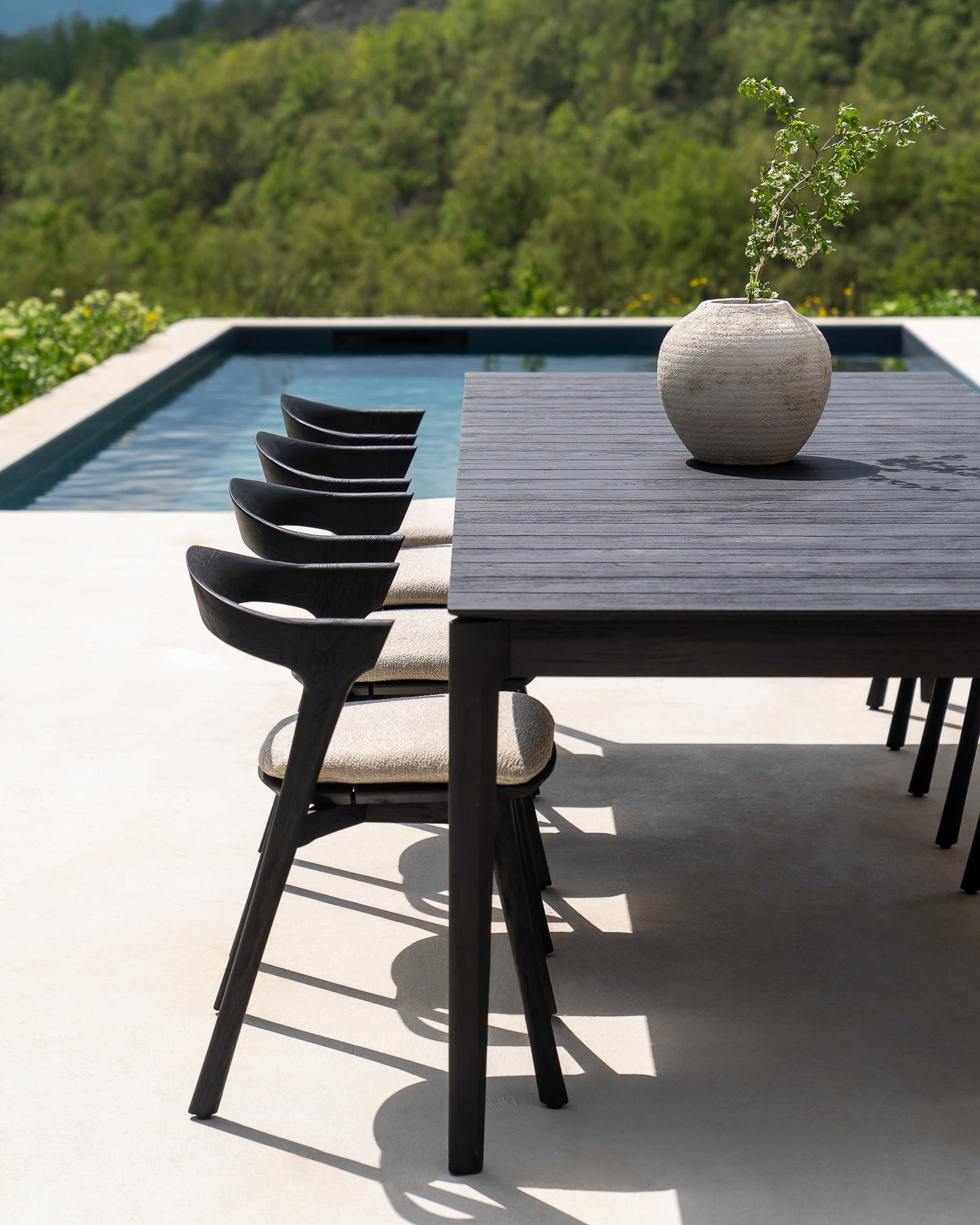 Bok-outdoor-black-chair-natural-cushion-Bok-outdoor-dining-table-Goode-Studio