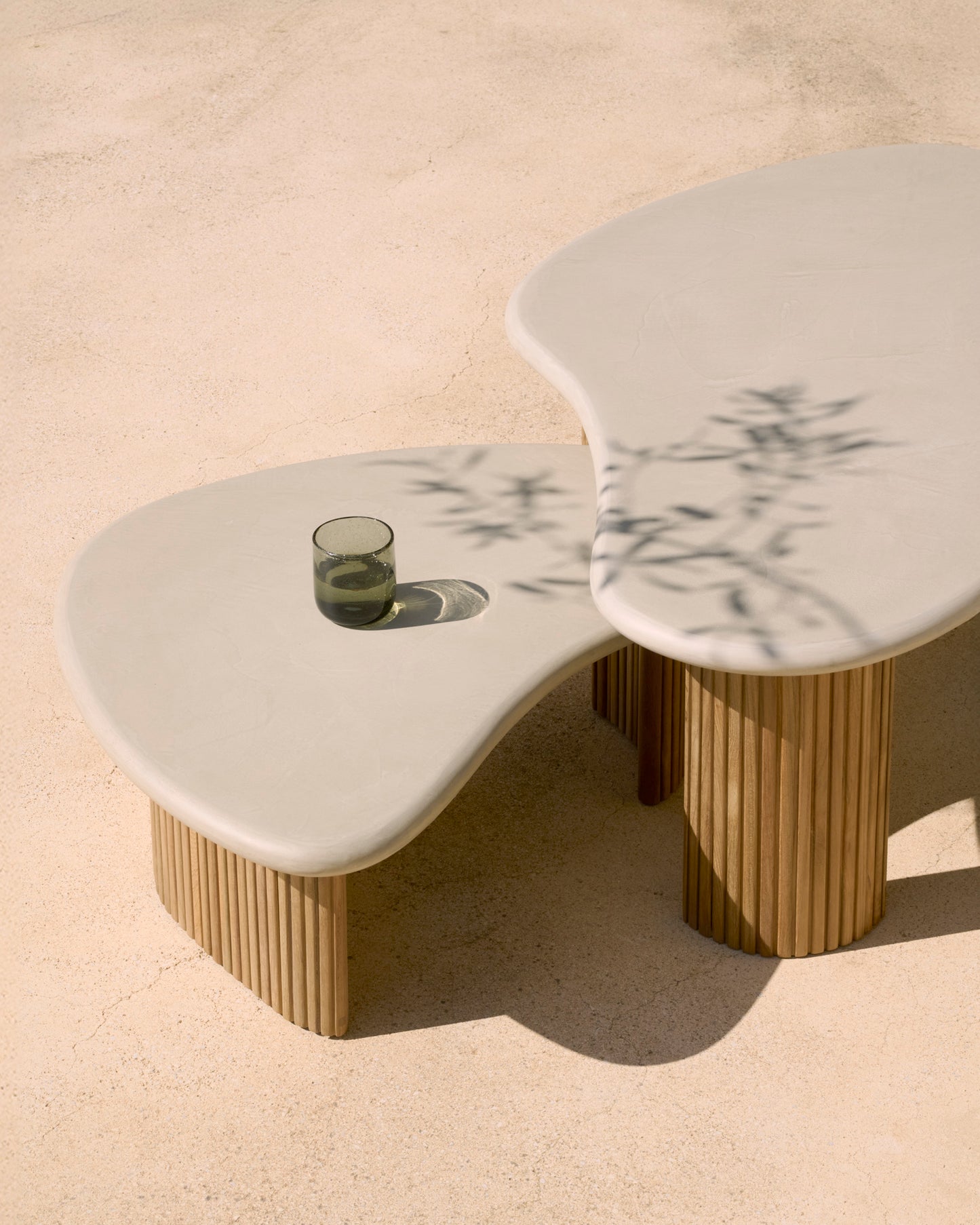 Boomerang-outdoor-coffee-table-concrete-top-reclaimed-teak-base-pebble-shape-Goode-Studio