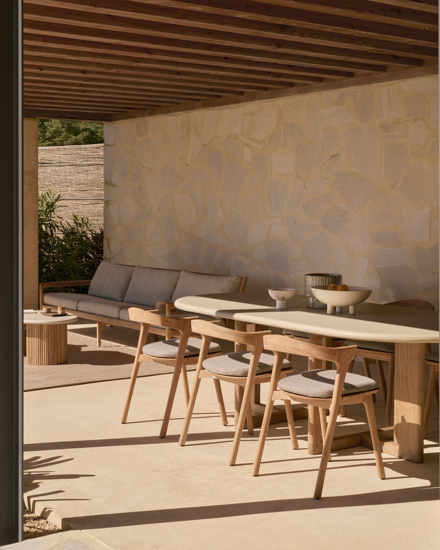 Trestle-Outdoor-dining-table-concrete-top-reclaimed-teak-Bok-outdoor-dining-chair-mocha-Goode-Studio