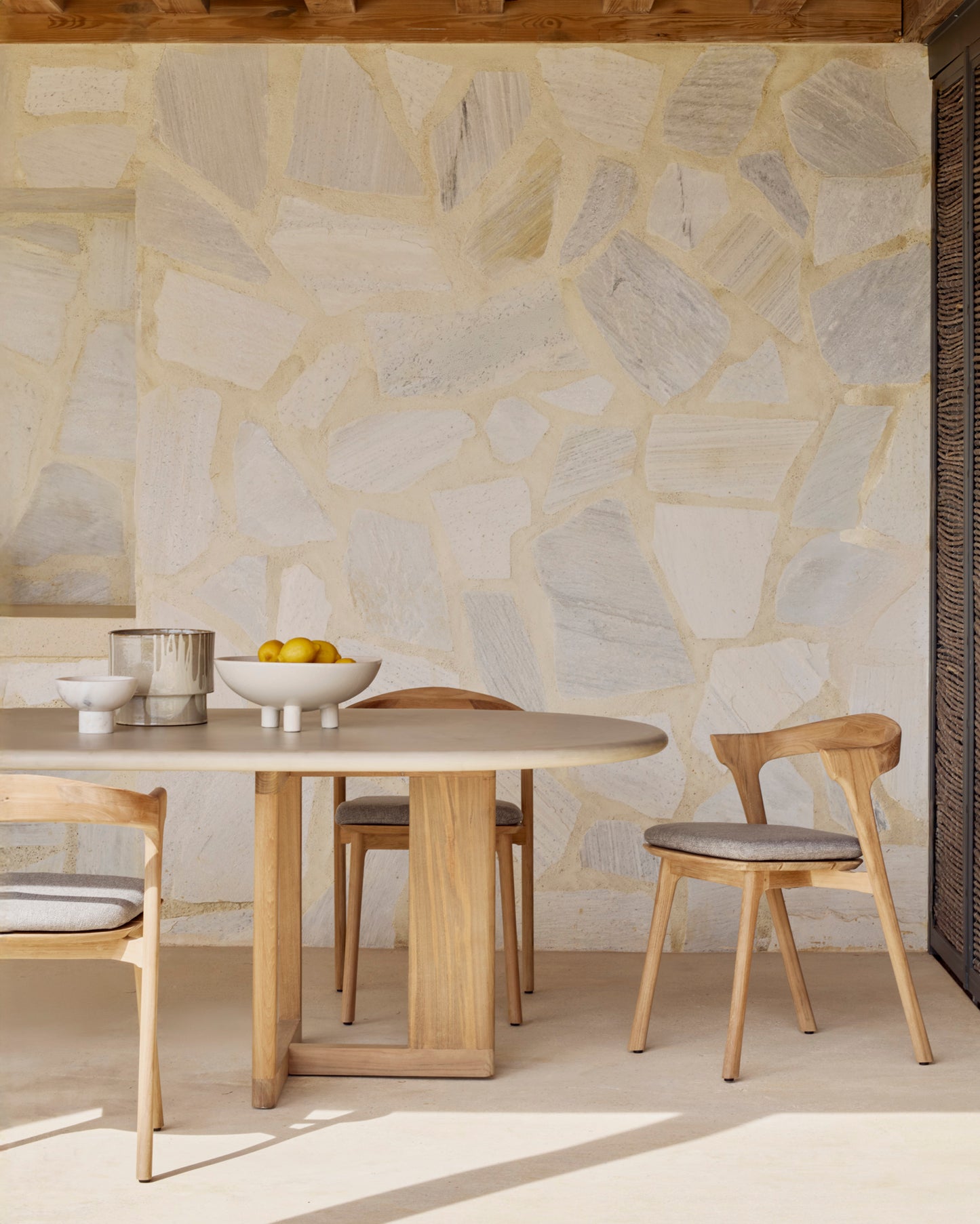 Trestle-Outdoor-dining-table-concrete-top-reclaimed-teak-Bok-outdoor-dining-chair-mocha-Goode-Studio