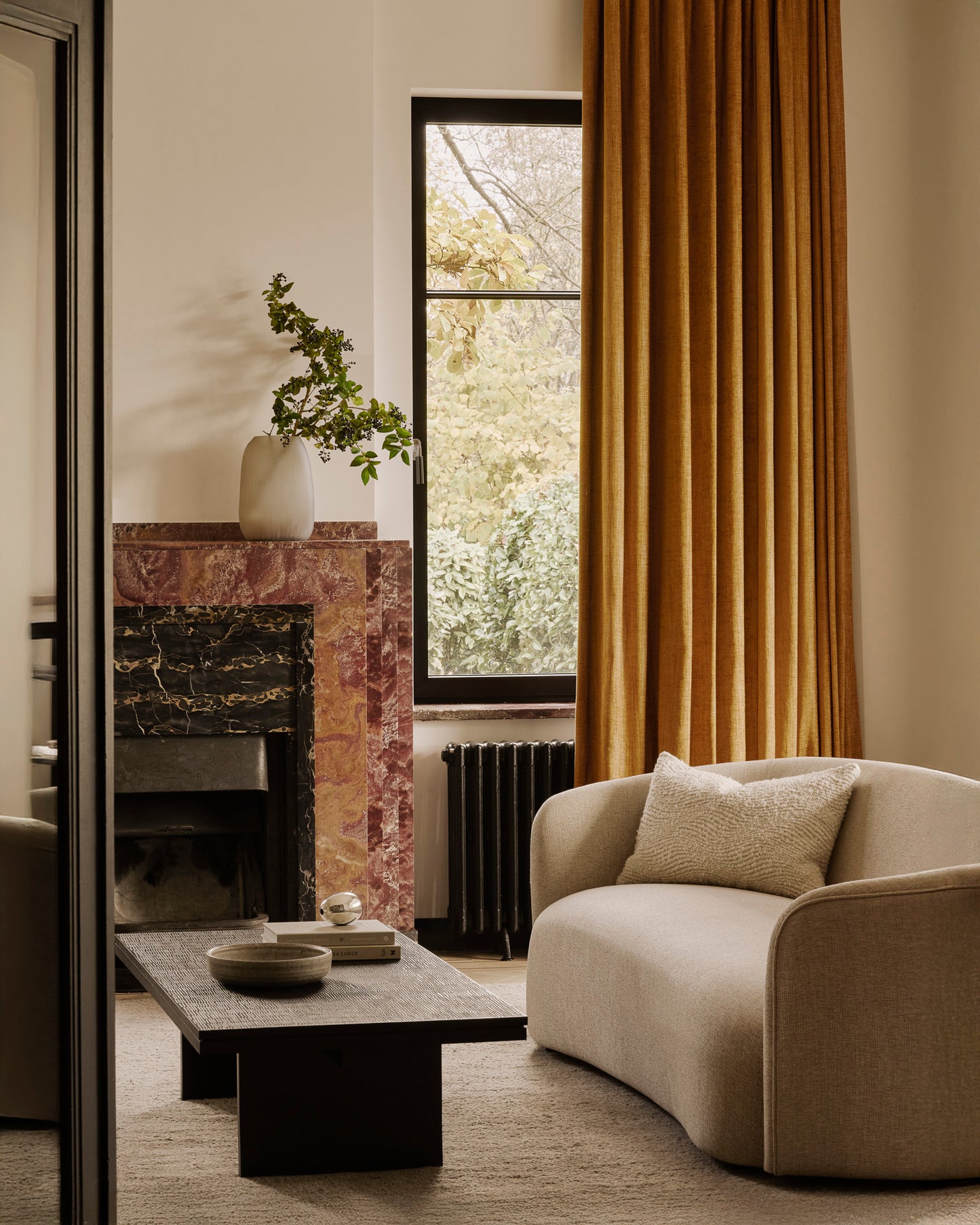 Grooves-coffee-table-varnished-teak-off-black-rectangular-Ellipse-sofa-Oatmeal-fabric-Wave-cushion-Dunes-rug-Cumin-Goode-Studio