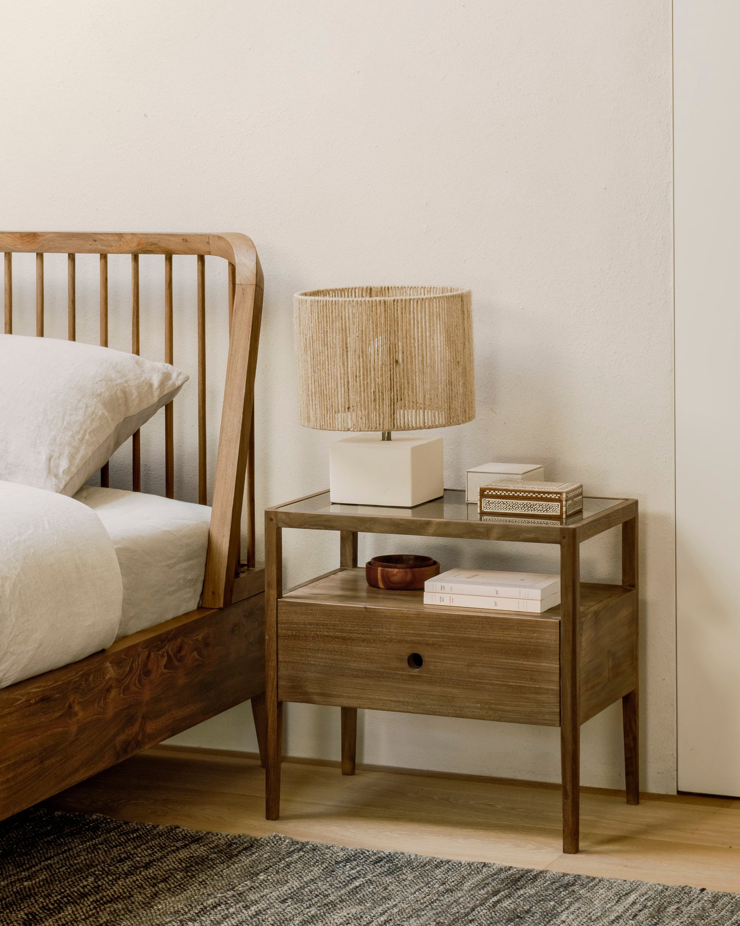Modern solid wood bedside table with tapered legs
