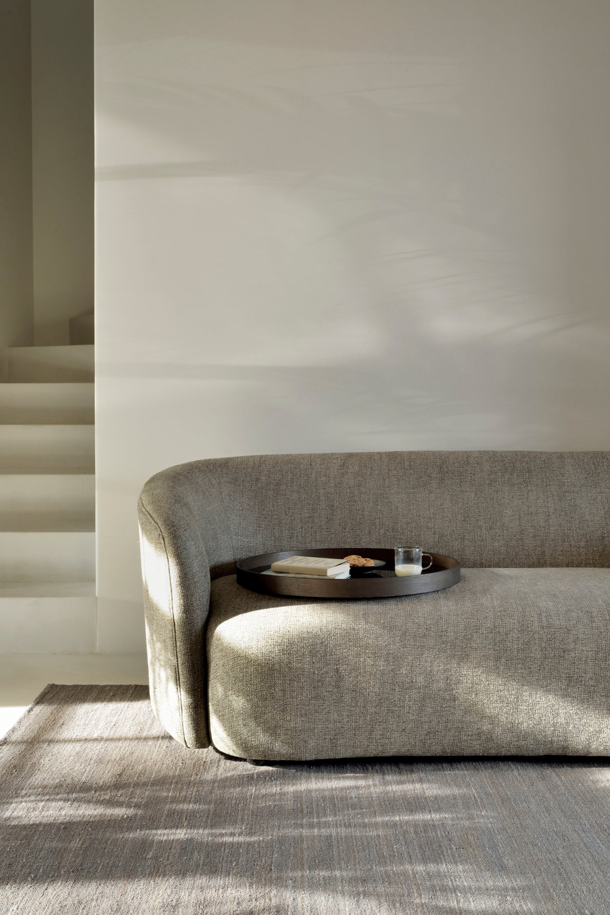 Ellipse-sofa-3-seater-ash-Grey-Nomad-kilim-rug-Graphite-Organic-tray-Goode-Studio