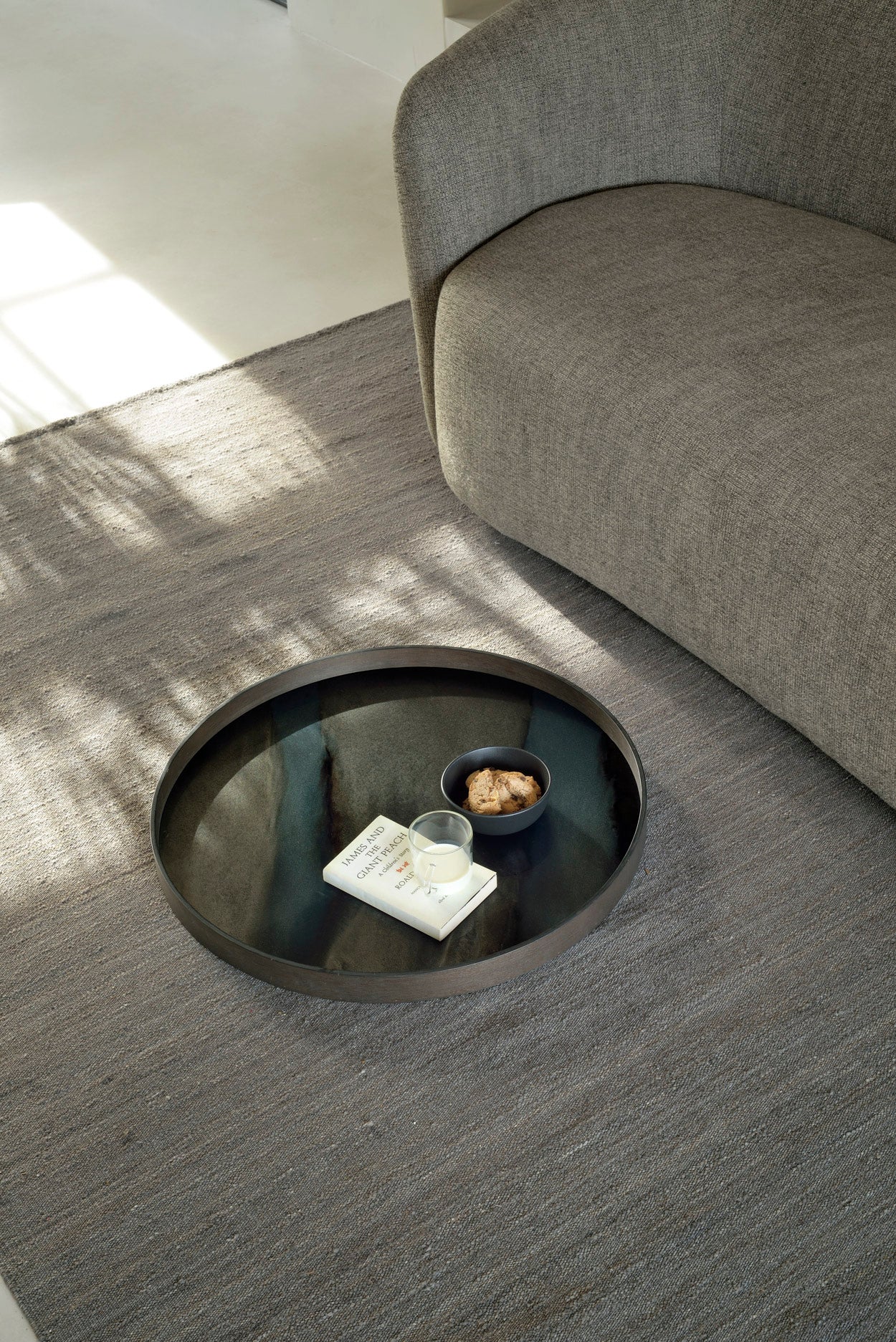 Ellipse-sofa-3-seater-ash-Grey-Nomad-kilim-rug-Graphite-Organic-tray-Goode-Studio