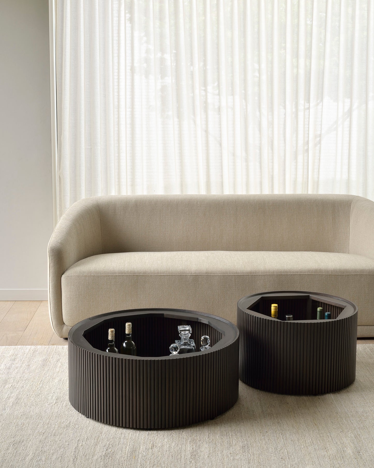 Trapeze-sofa-beige-Mahogany-Roller-Max-coffee-table-Goode-Studio