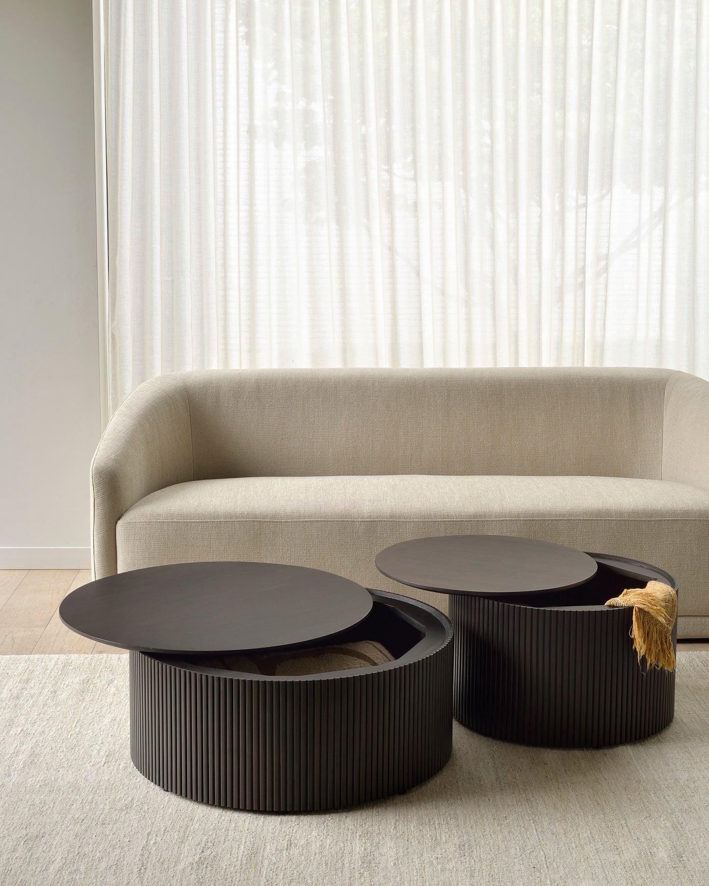 Trapeze-sofa-beige-Mahogany-Roller-Max-coffee-table-Goode-Studio