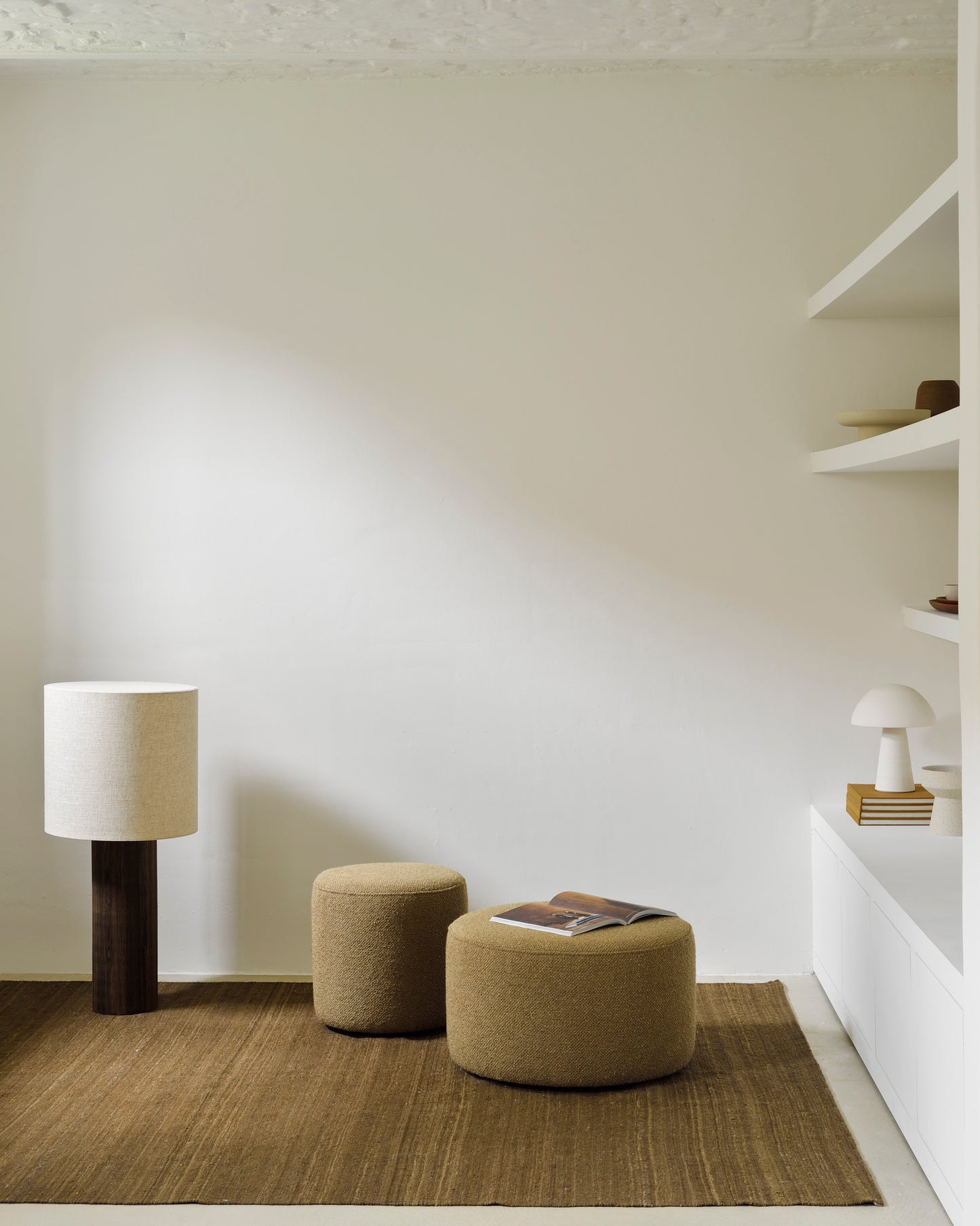 Barrow poufs with ginger Nomad kilim rug cumin by Goode Studio