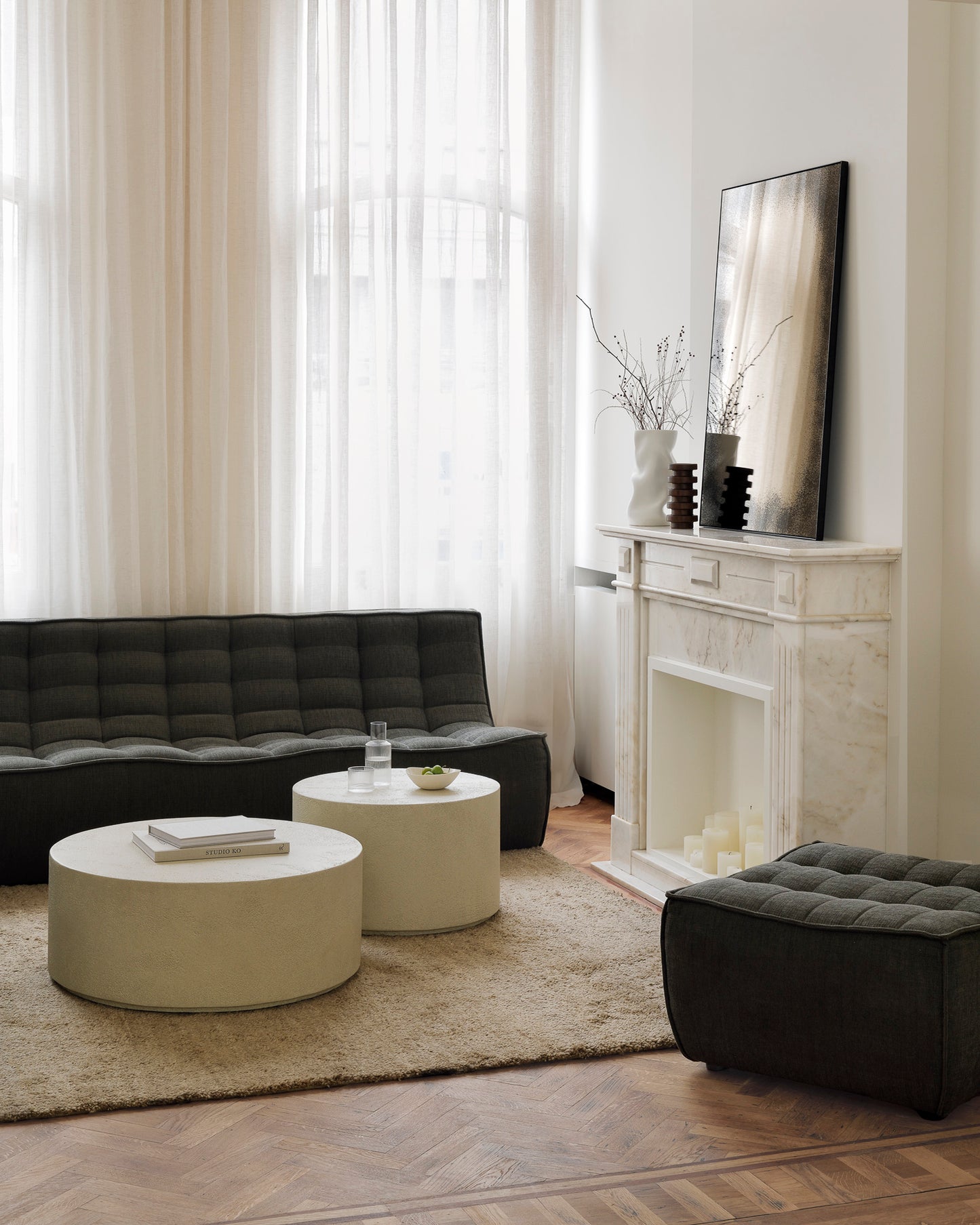 N701-3-seater-footstool-Moss-Eco-Elements-coffee-table-off-white-Aged-wall-mirror-bronze-Dunes-rug-Pisa-object-Goode-Studio
