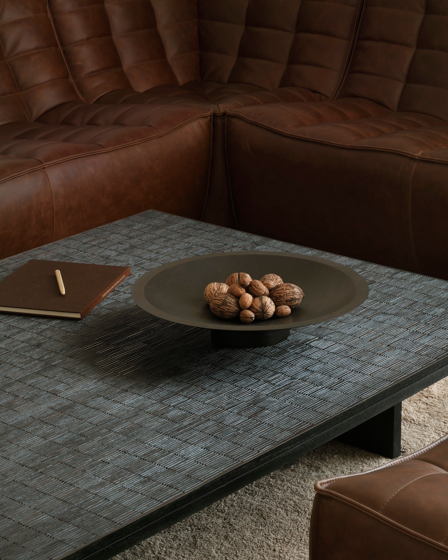 N701-modular-sofa-Chestnut-leather-Grooves-coffee-table-Off-Black-Dunes-rug-Sand-Goode-Studio
