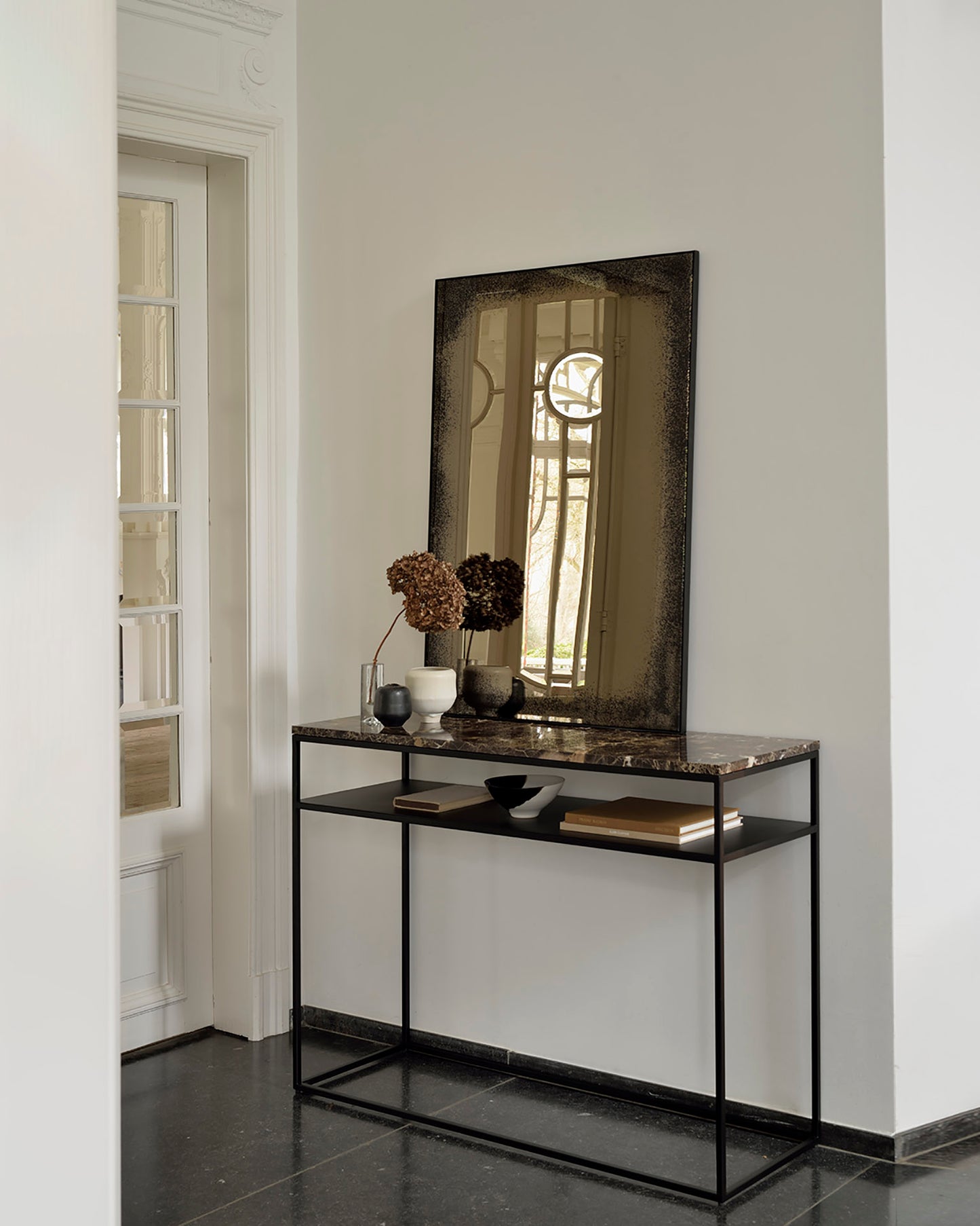 Bronze-wall-mirror-Stone-console-dark-emperador-Goode-Studio