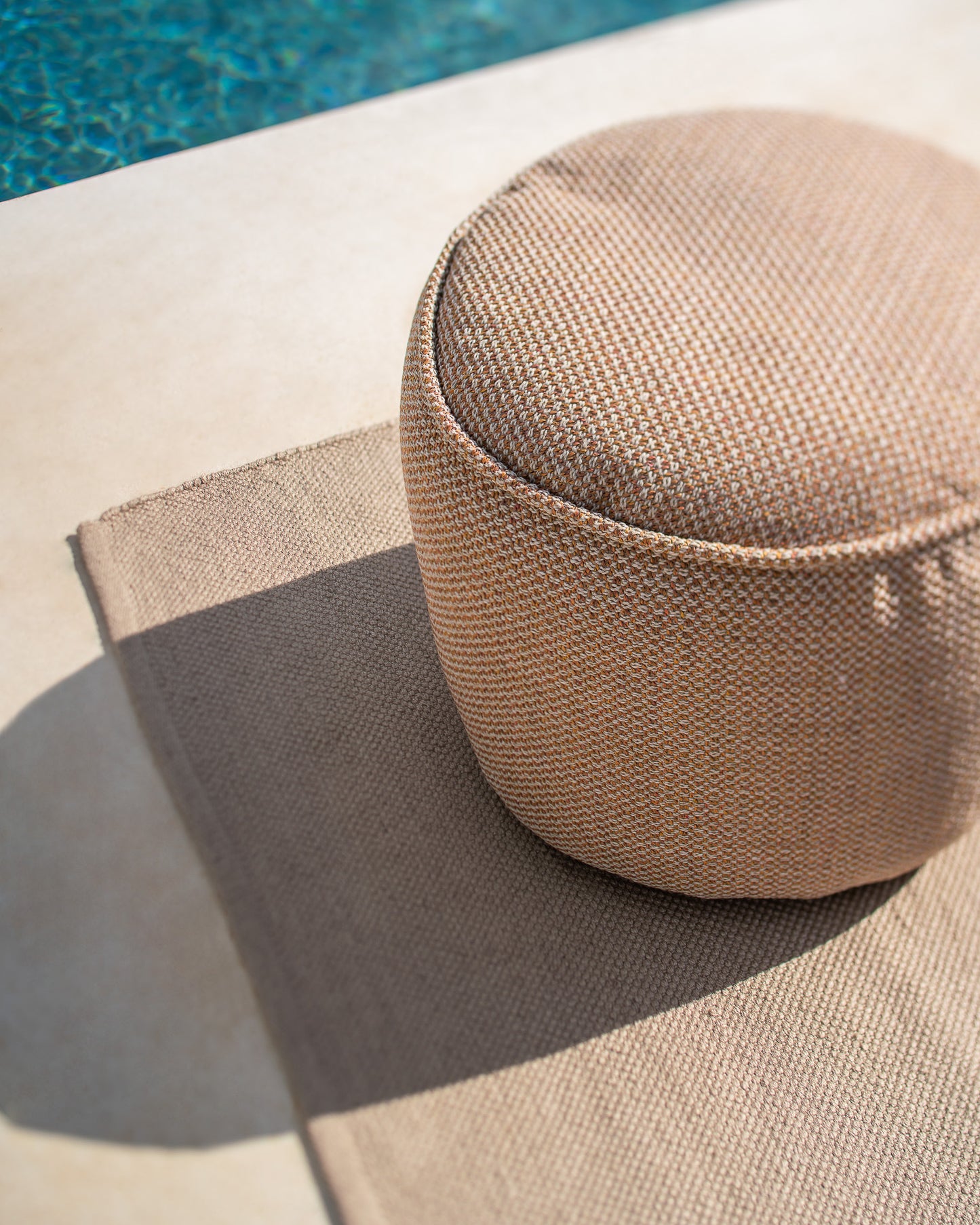 Nomad-rug-Donut-pouf-marsala-Goode-Studio