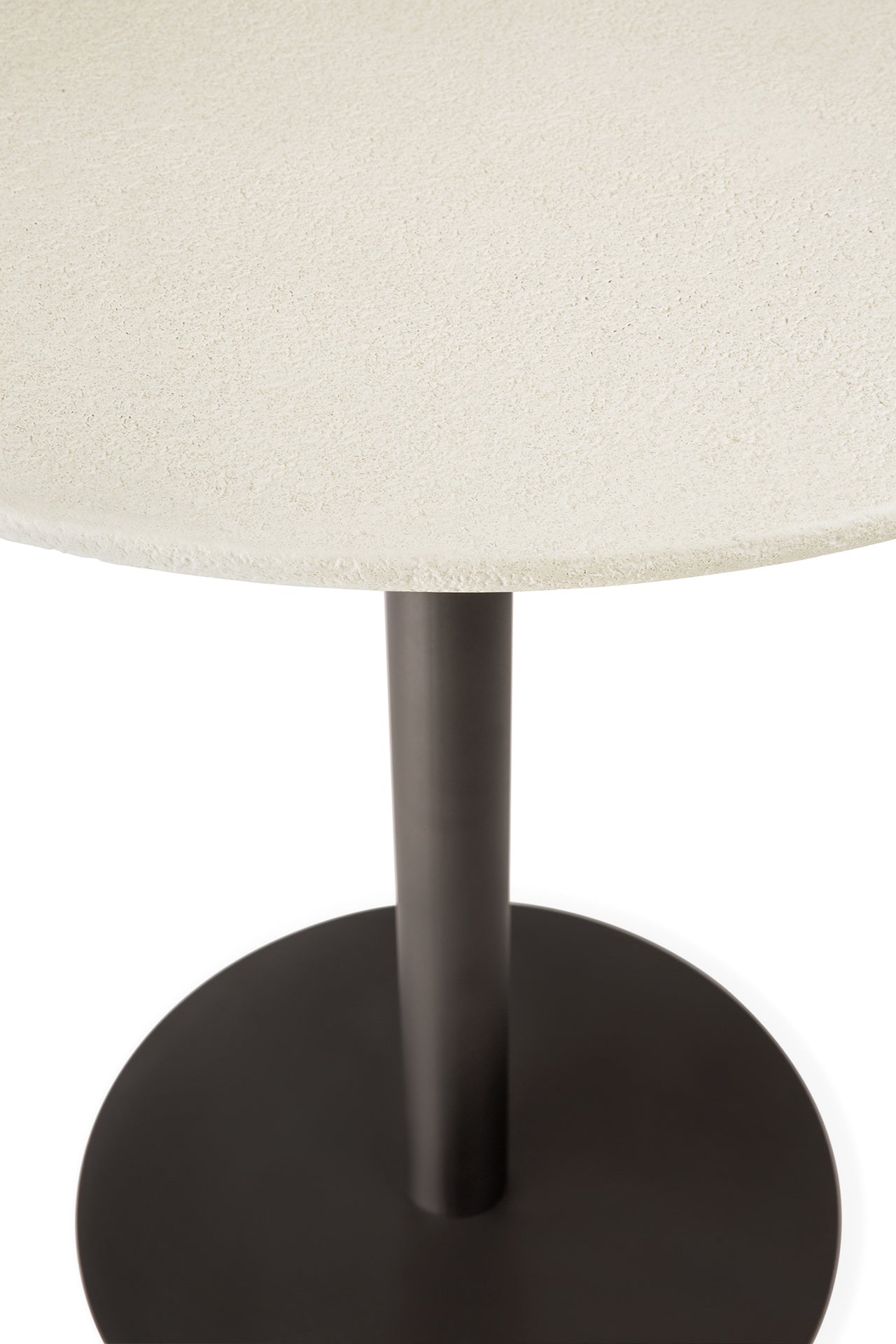 Close-up of a table with a round top and black base.