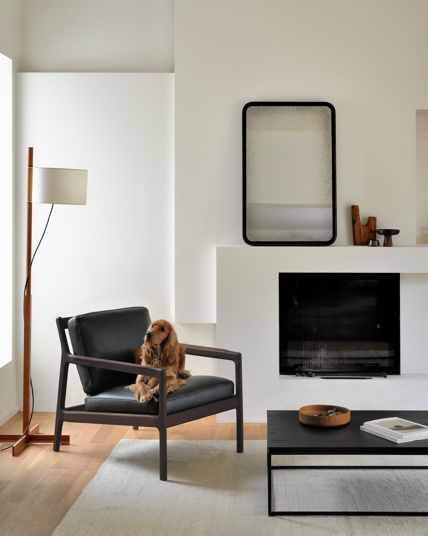 Jack-lounge-chair-Oak-Thin-black-coffee-table-Clear-Edge-wall-mirror-Goode-Studio