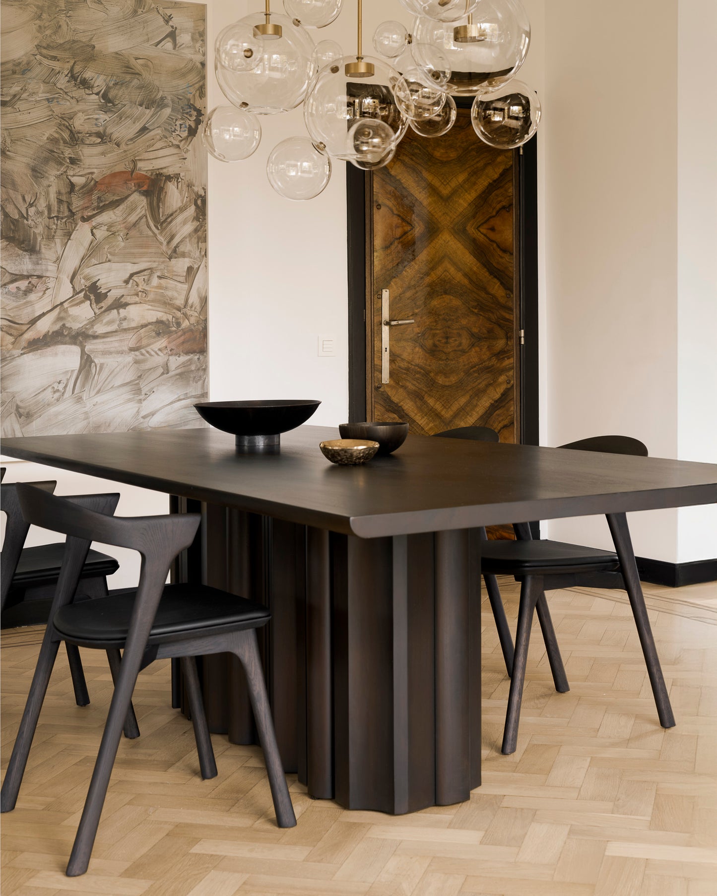 Sequence mahogany dining table sculptural base design
