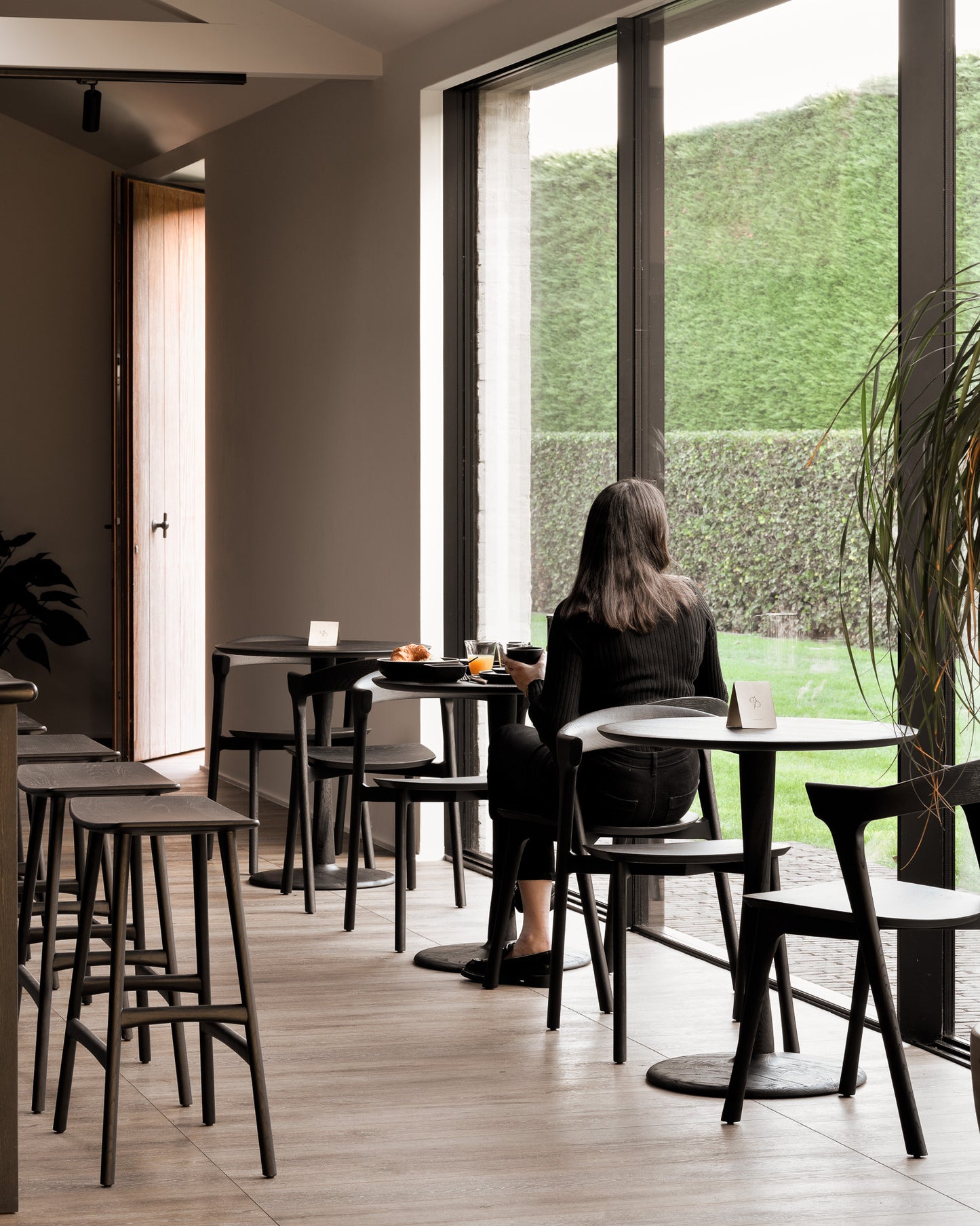 Torsion-table-round-black-Bok-dining-chair-black-Osso-counter-stool-Goode-Studio