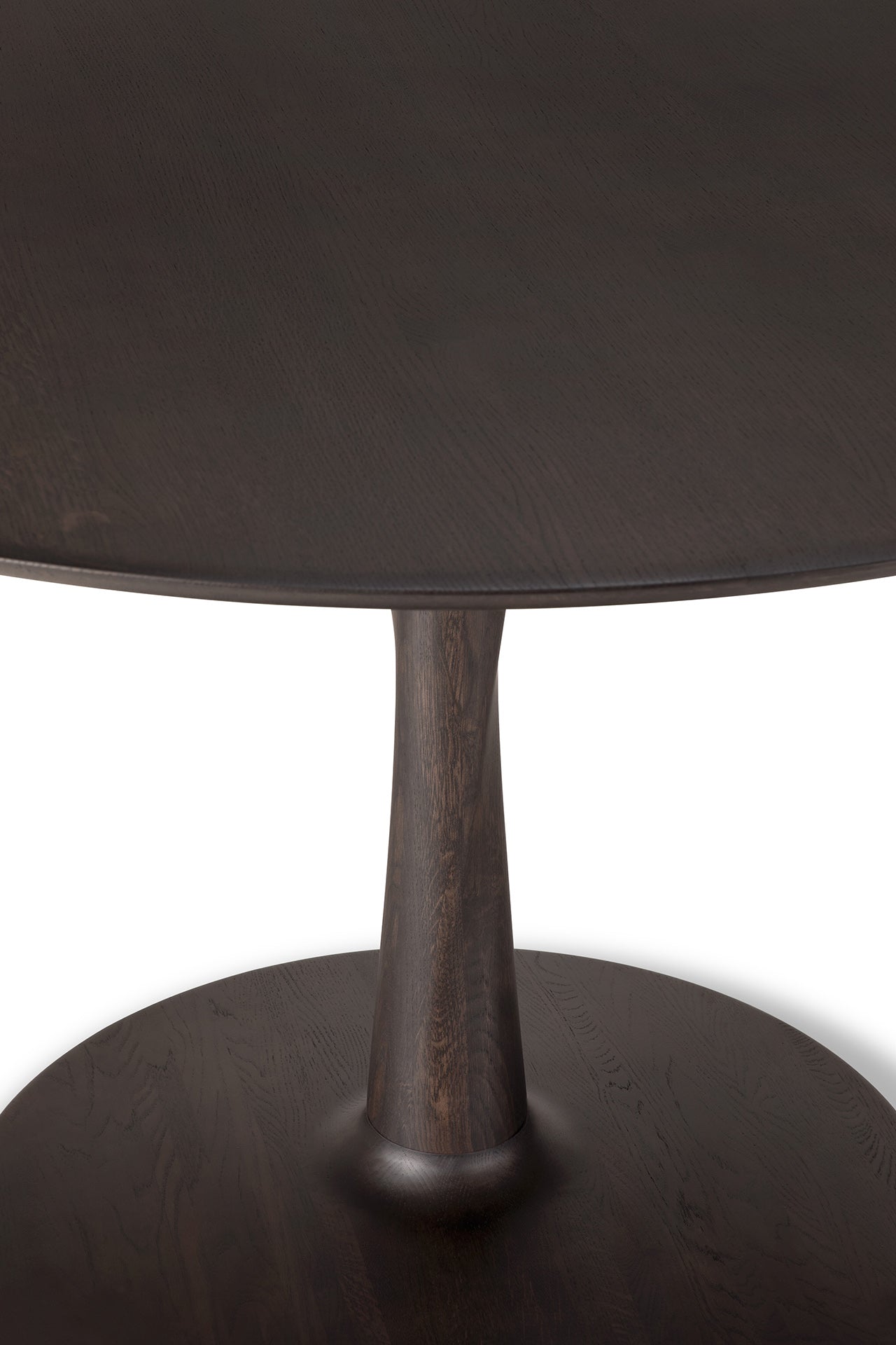Torsion dining table in oak brown for model home dining space
