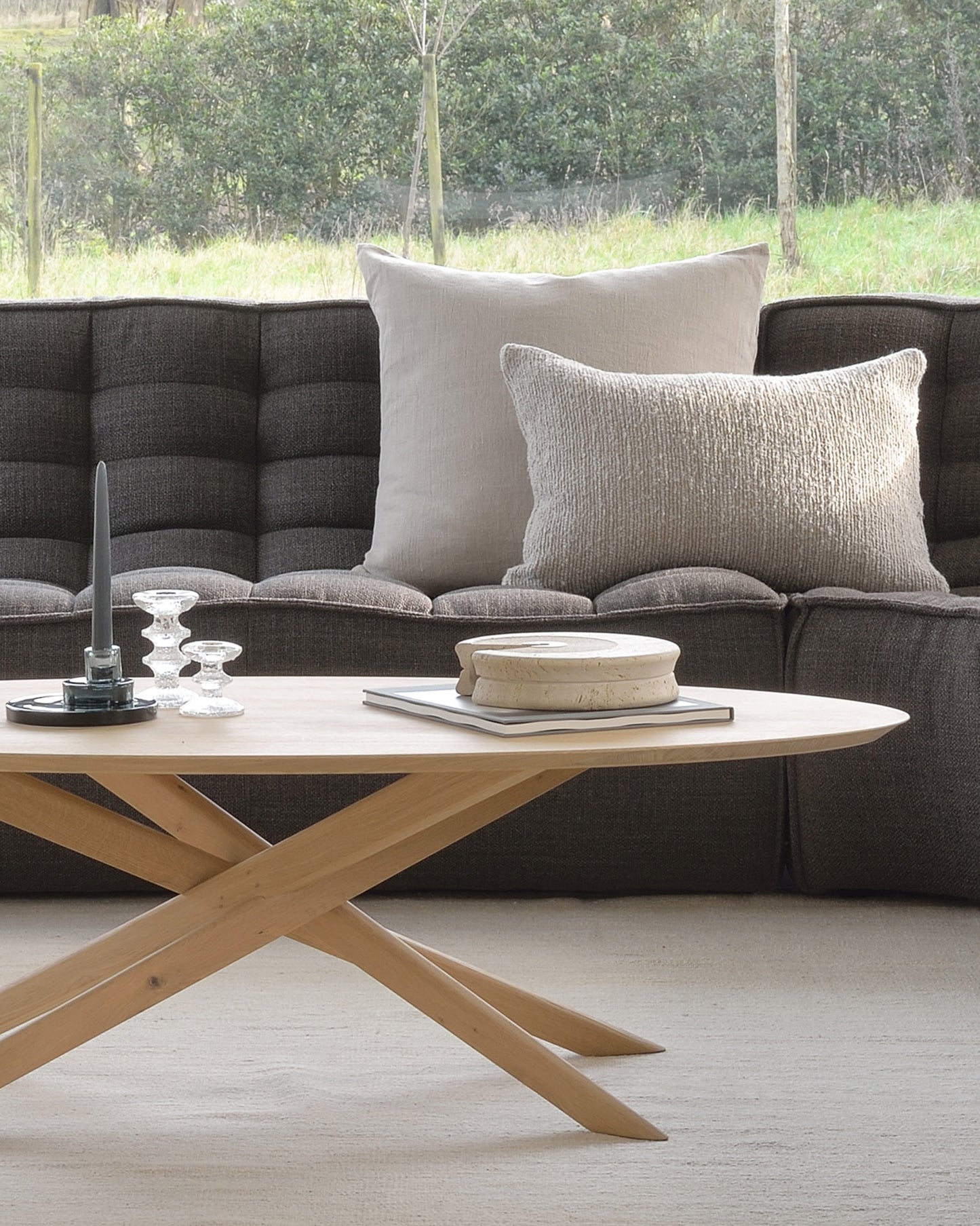 Oak-Mikado-coffee-table-N701-sofa-roundcorner-N701-sofa-3seater-Sand-Nomad-kilim-rug-cushions-Goode-Studio