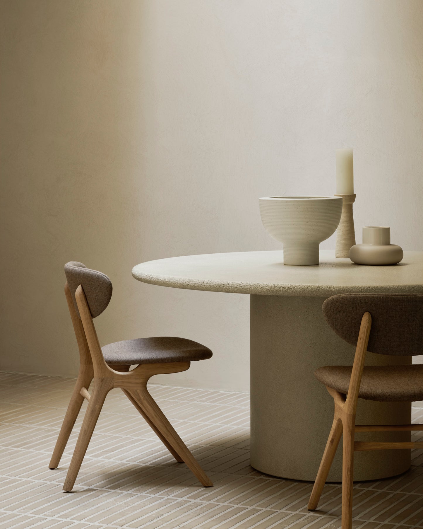 Elements round dining table sculptural off white stone texture
