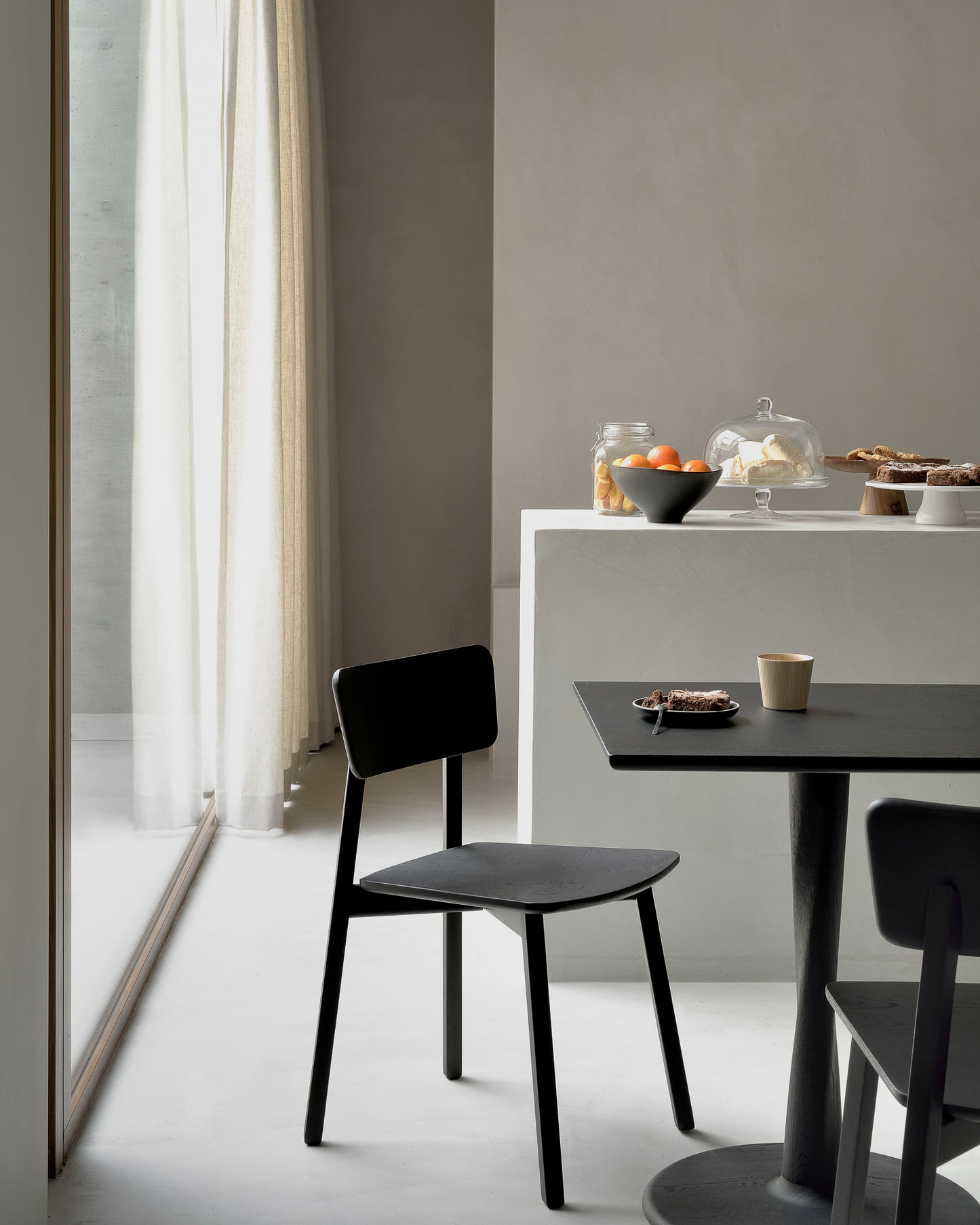 Oak-Casale-black-dining-chair-Oak-Torsion-square-black-dining-table-Goode-Studio