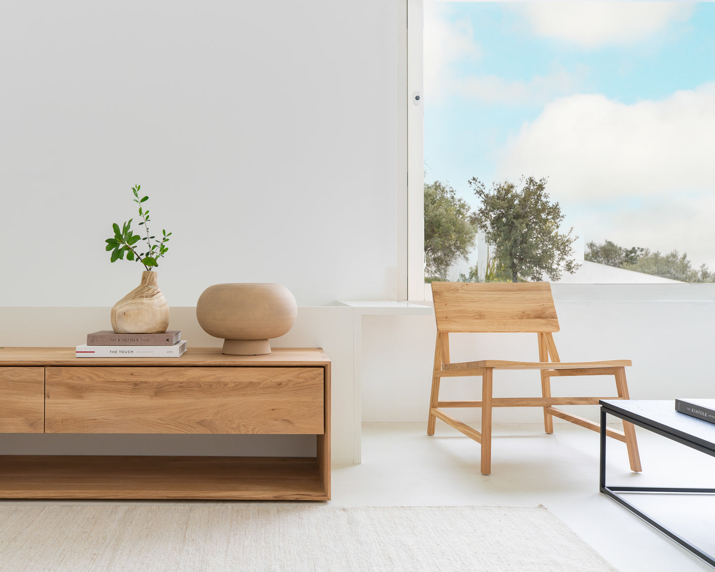 N2-lounge-chair-Nordic-TV-cupboard-Thin-coffee-table-Sand-Nomad-kilim-rug-Goode-Studio