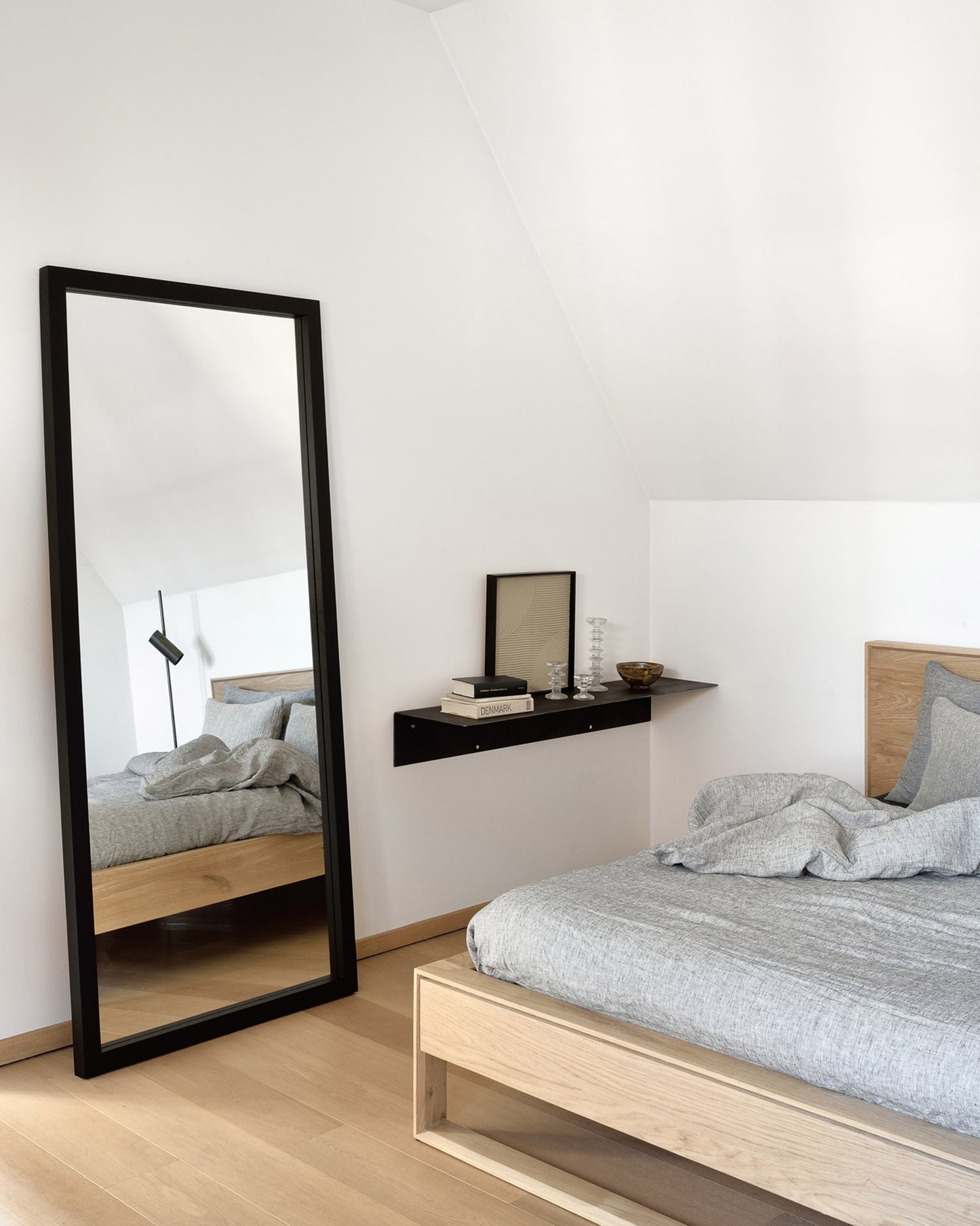 Oak-NordicII-bed-Oak-Light-Frame-black-floor-mirror-Oat-Nomad-cushion-Goode-Studio