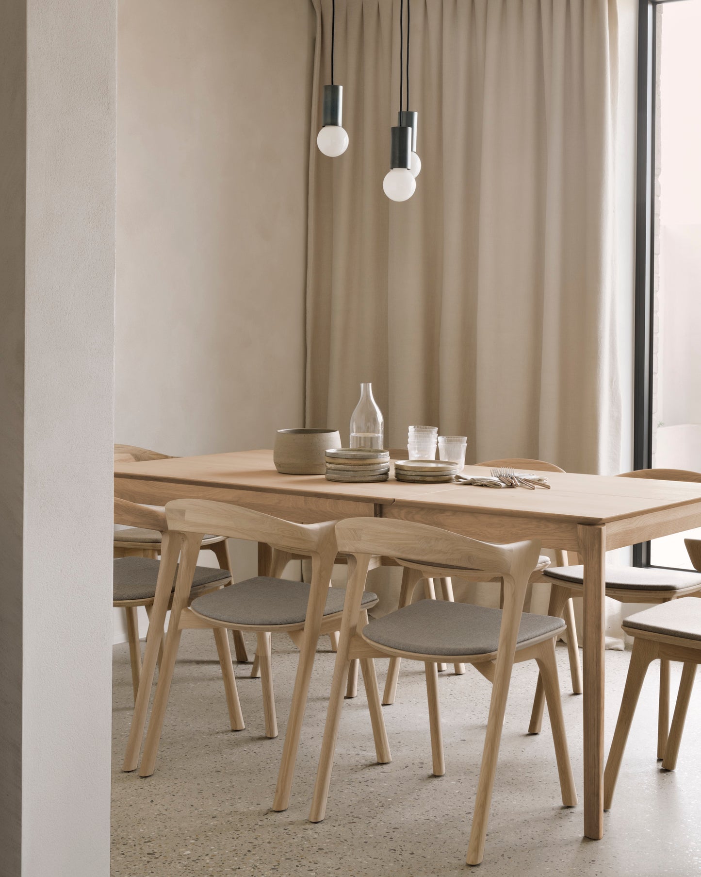 Natural oak extendable dining table for model home interiors
