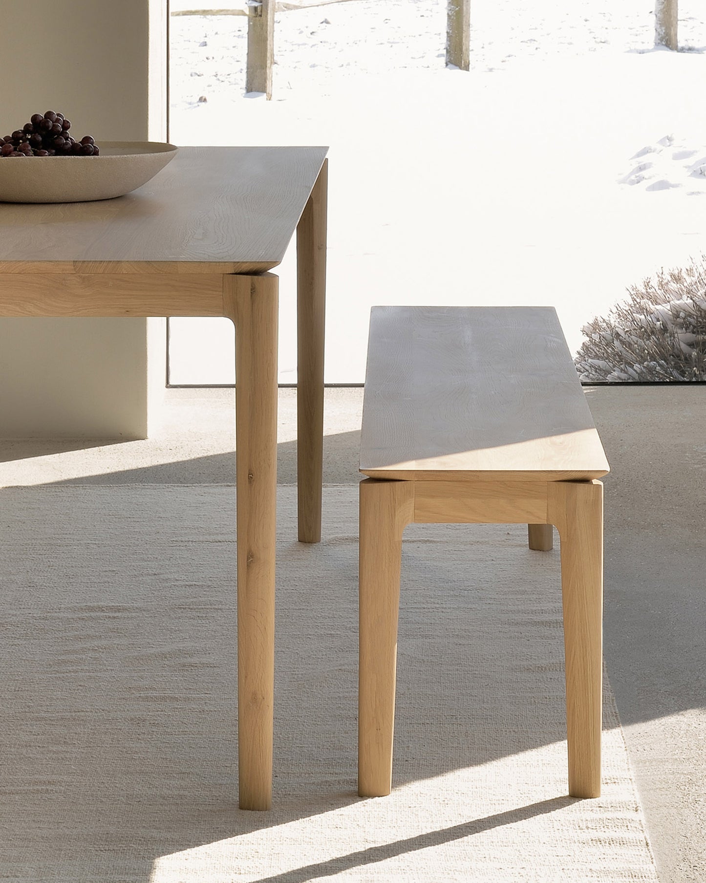 Scandinavian inspired solid oak dining table with curved legs
