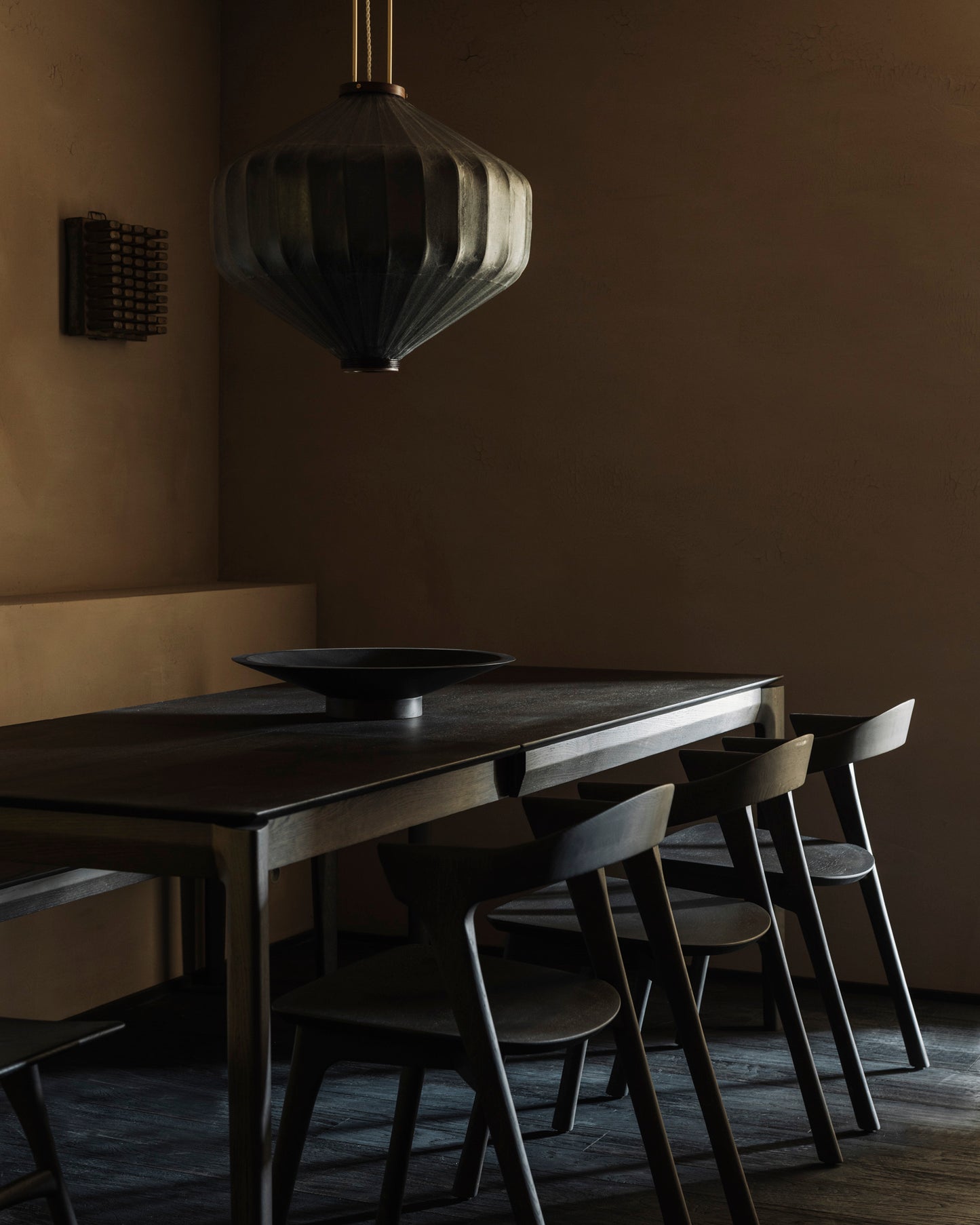 Bok extendable dining table in brown with Bok dining chairs and dark brown Satellite bowl by Goode Studio