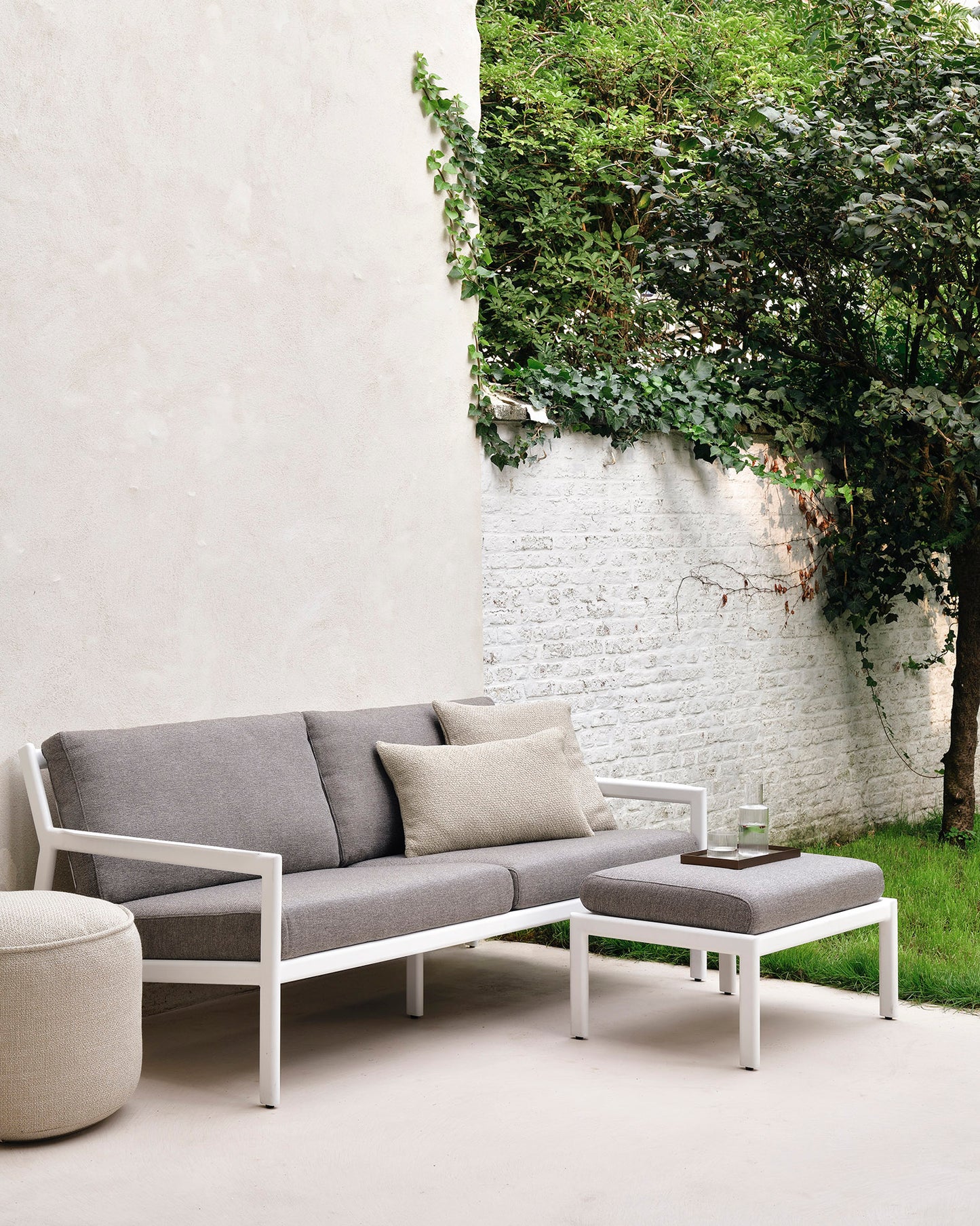 Jack-outdoor-sofa-aluminium-2-seater-mocha-Jack-footstool-mocha-Donut-pouf-natural-Goode-Studio