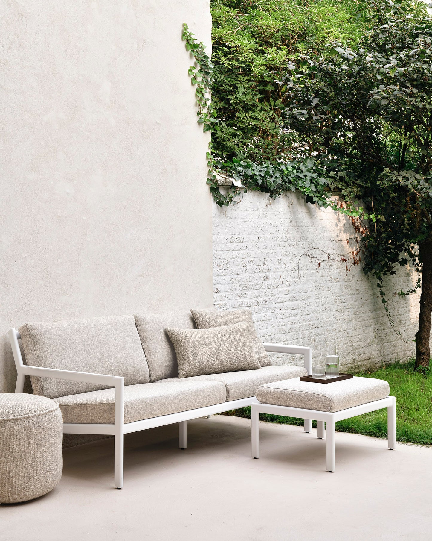 Jack-outdoor-sofa-aluminium-2-seater-natural-Jack-footstool-natural-Donut-pouf-natural-Goode-Studio